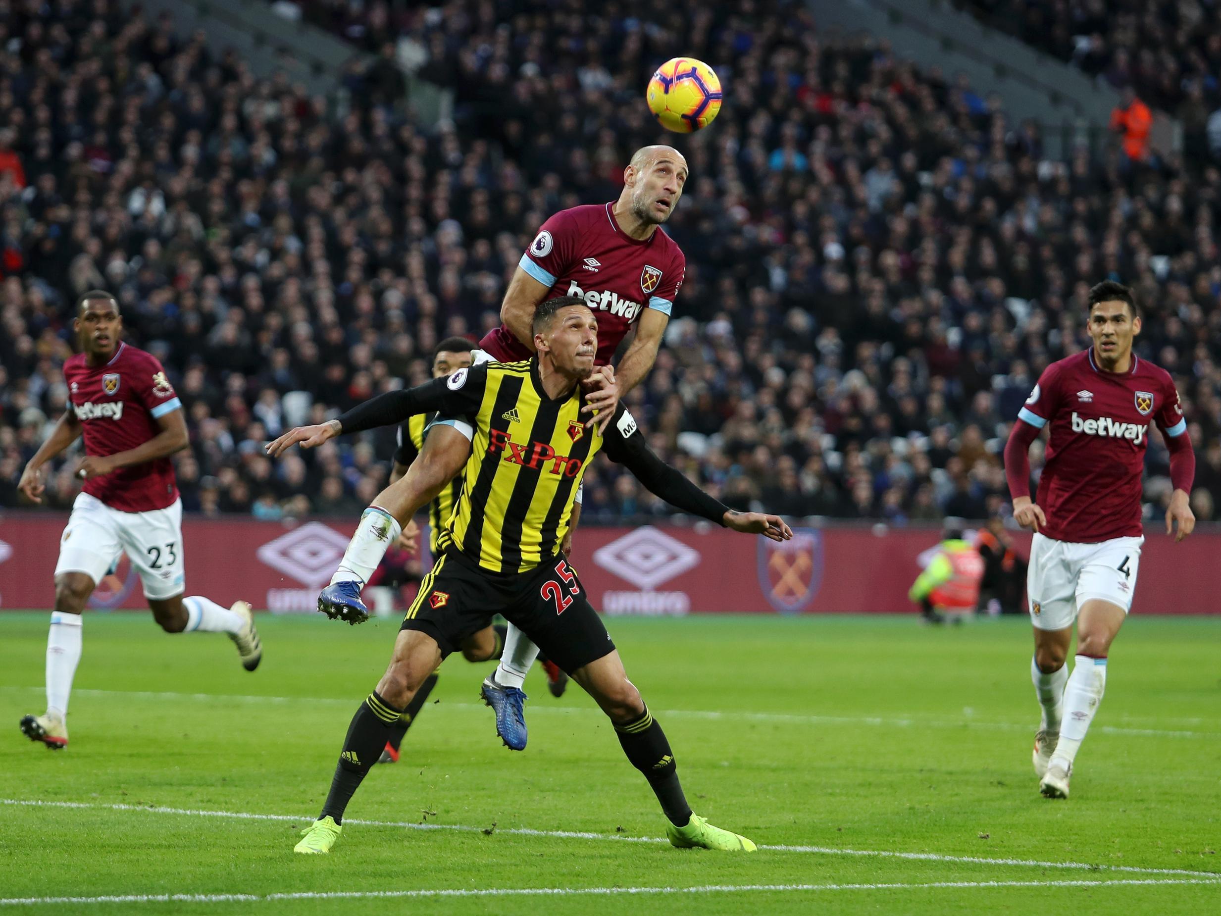 Pablo Zabaleta wins a header over Jose Holebas