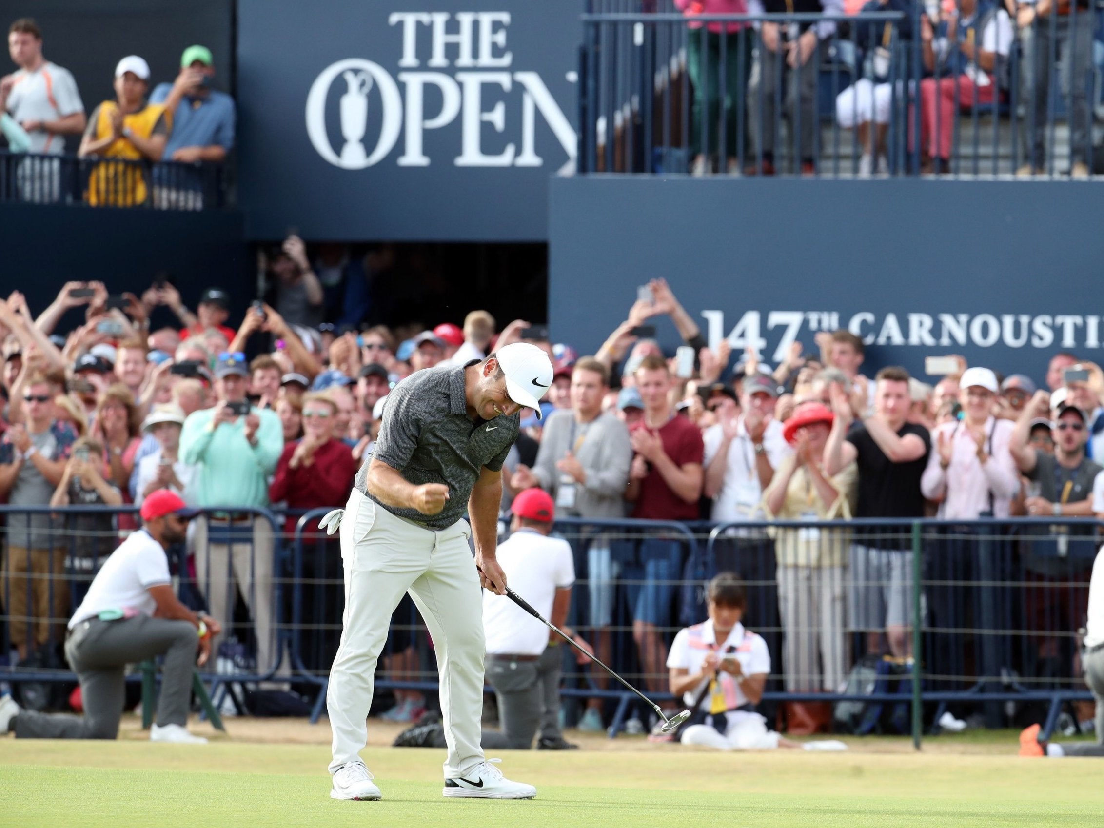 Francesco Molinari sinks the winning putt on the 18th at Carnoustie