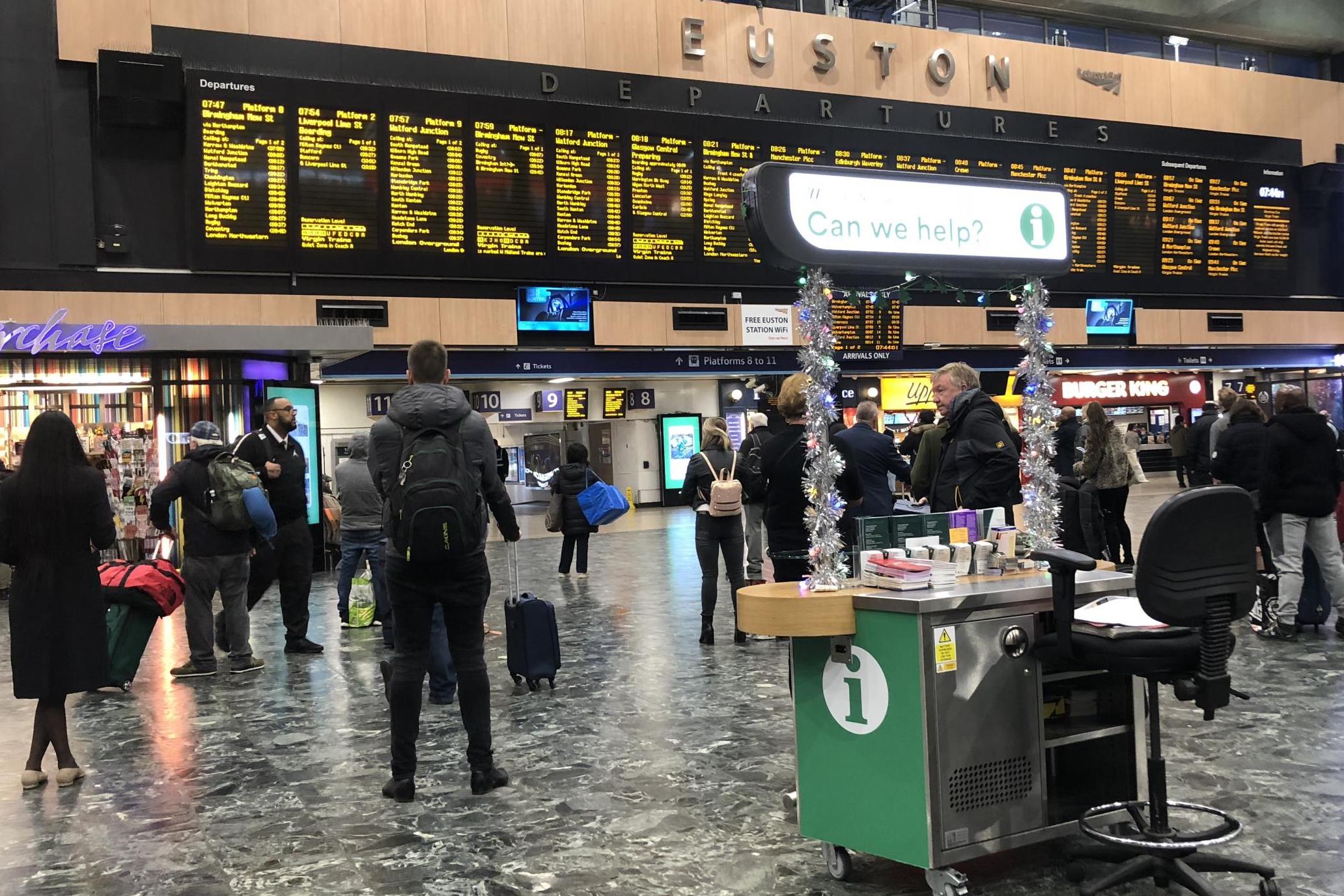 Final call: passengers at London Euston on Christmas Eve