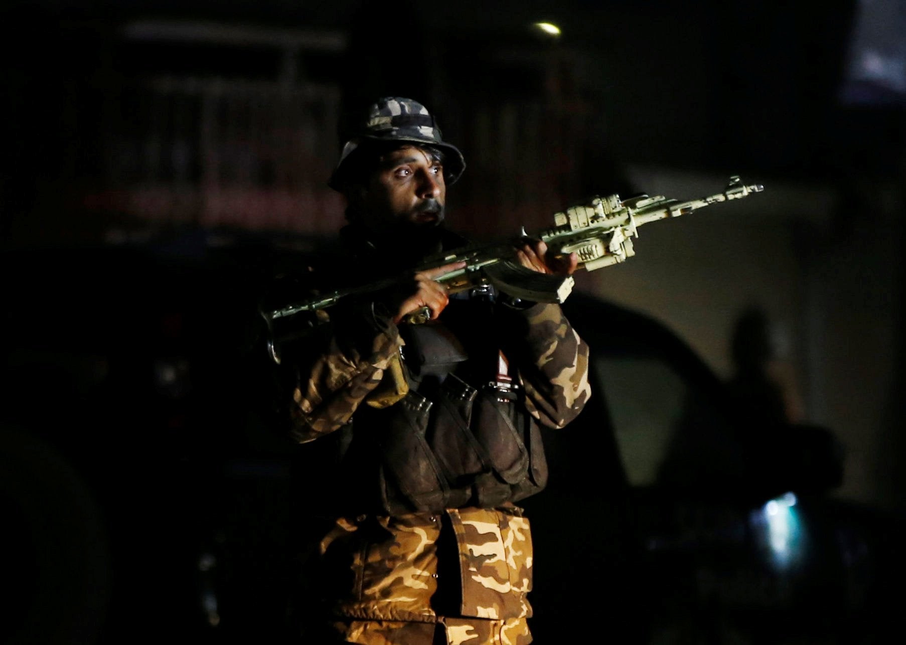 A member of Afghan security force takes position at the site of an attack in Kabul, Afghanistan December 24, 2018.