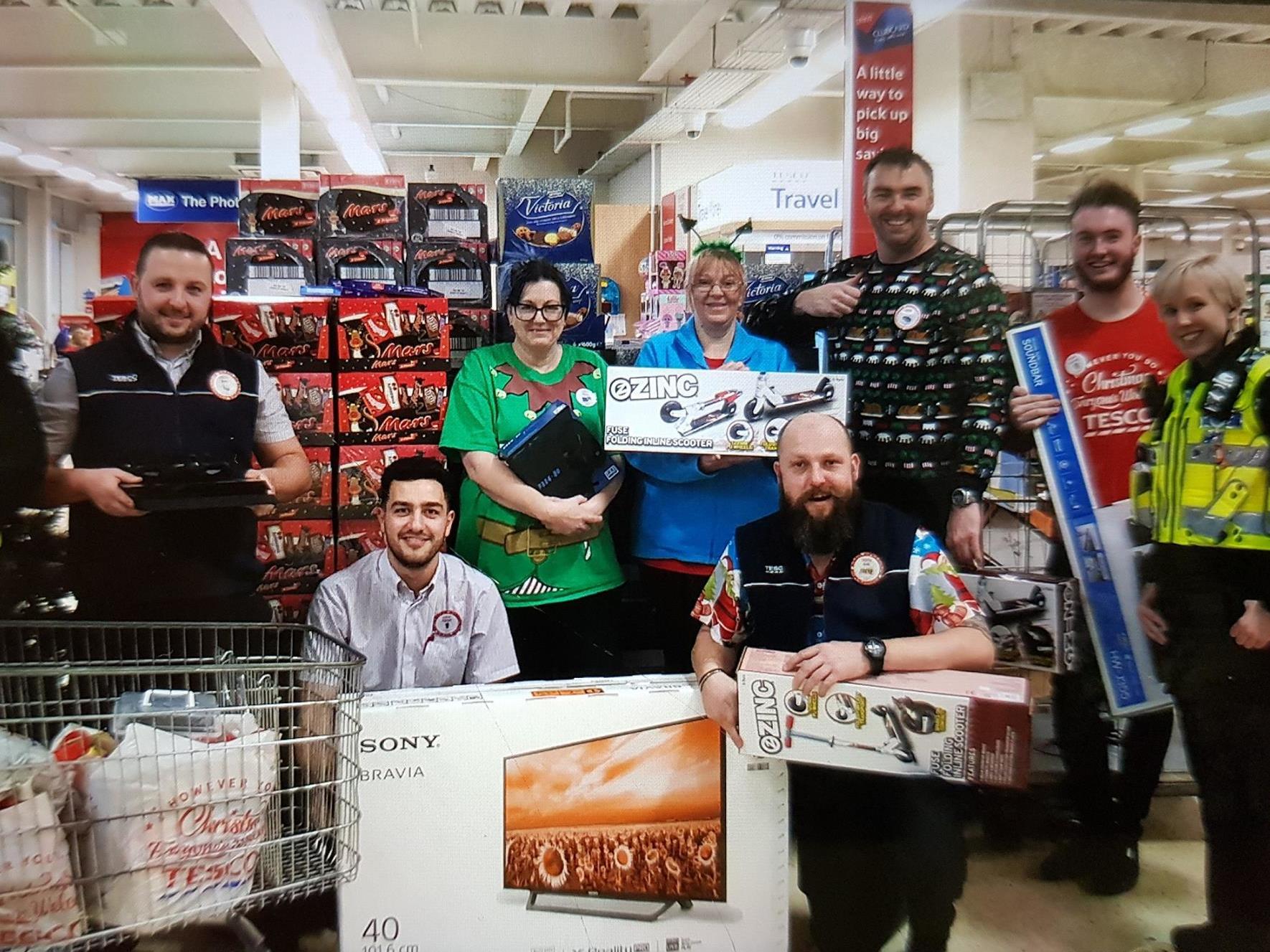 Police officers and Tesco staff bought a family Christmas presents and food after discovering they had little at home