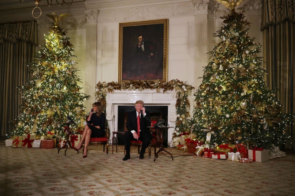 Donald and Melania Trump as they track Santa's movements with the NORAD Santa Tracker on Christmas Eve at the White House in Washington, DC