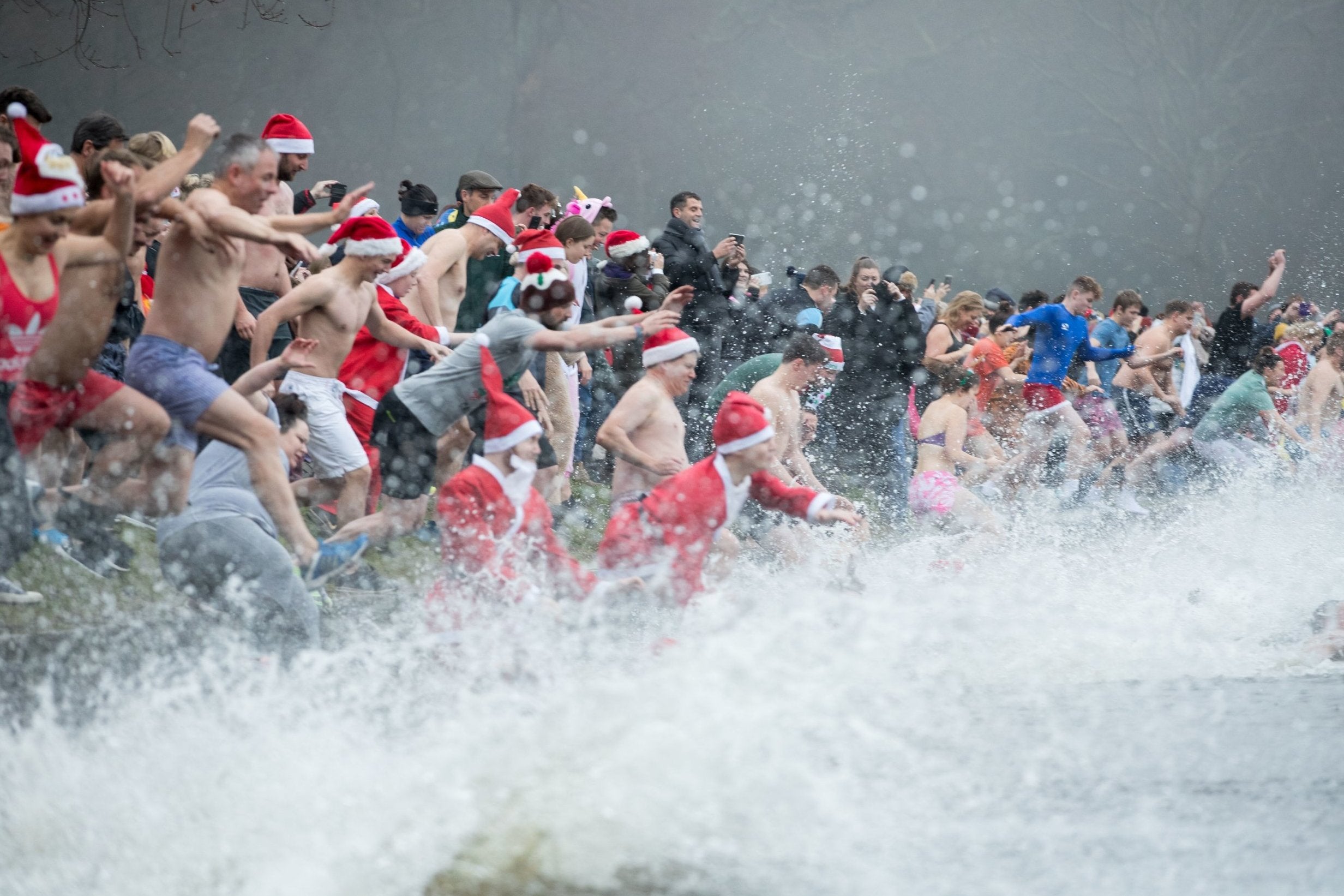 People take a Christmas day swim in Blackroot Pool at Sutton Park in Sutton Coldfield.