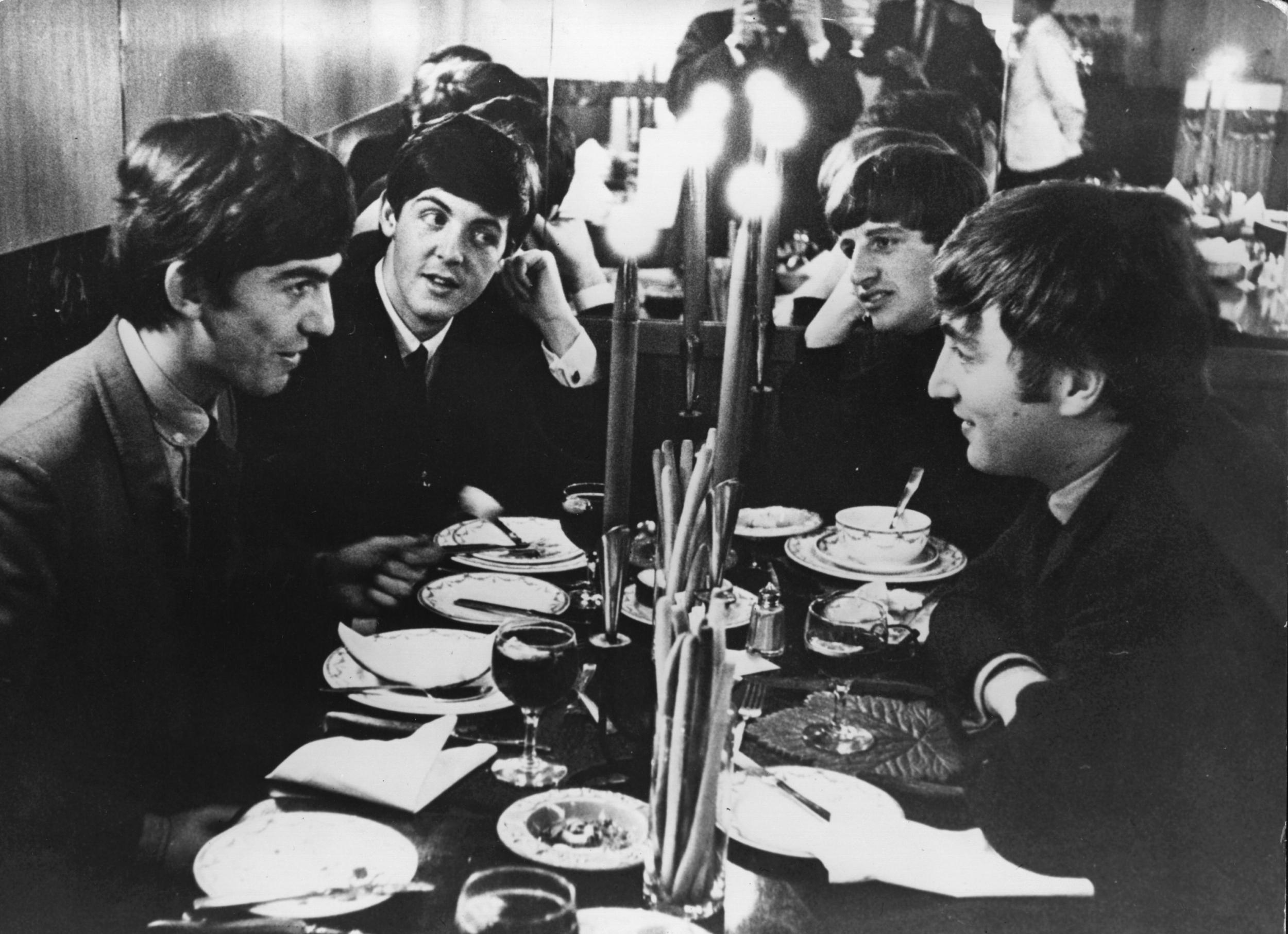 The Beatles meet for the first time after their holidays on 5 October, 1963 at the Star Steak House in Shaftsbury Avenue, London. (Photo by Keystone/Getty Images)