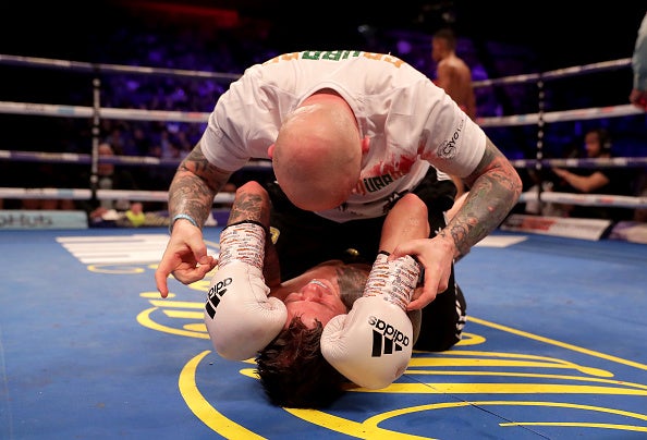 Edwards celebrates with his trainer Grant Smith after the final bell