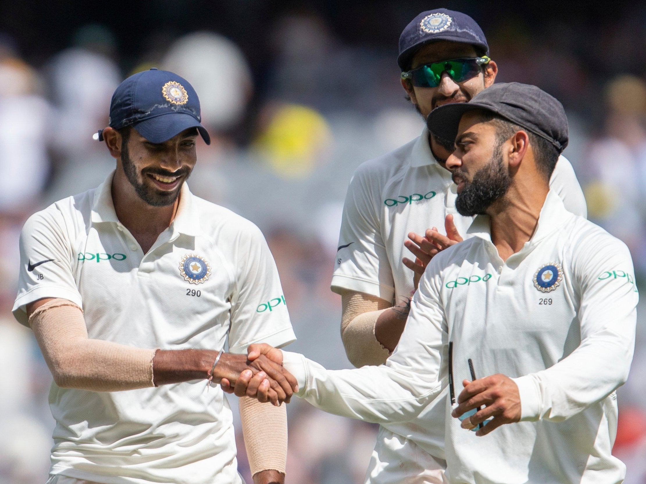 Virat Kohli congratrulates Jasprit Bumrah at the end of play on day three