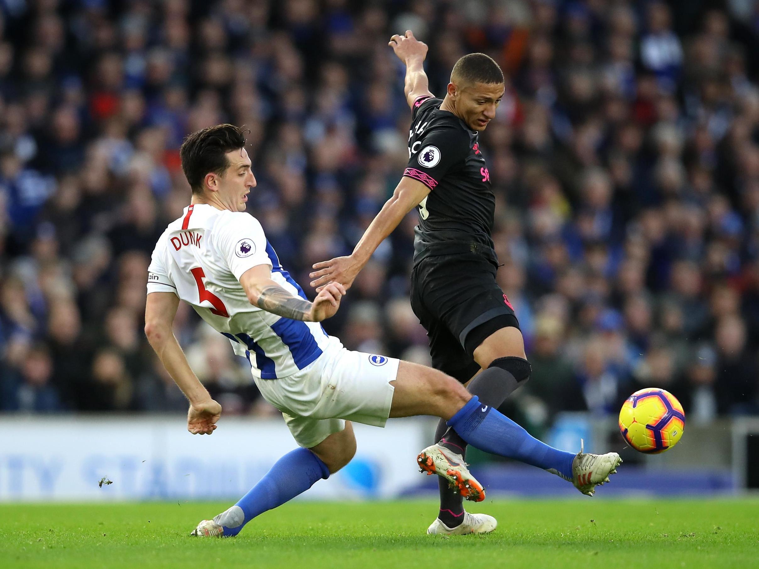 Lewis Dunk puts in a challenge on Richarlison