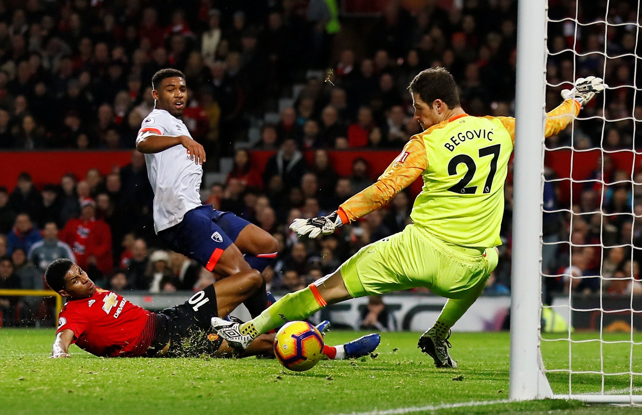 Marcus Rashford angles a shot past Asmir Begovic