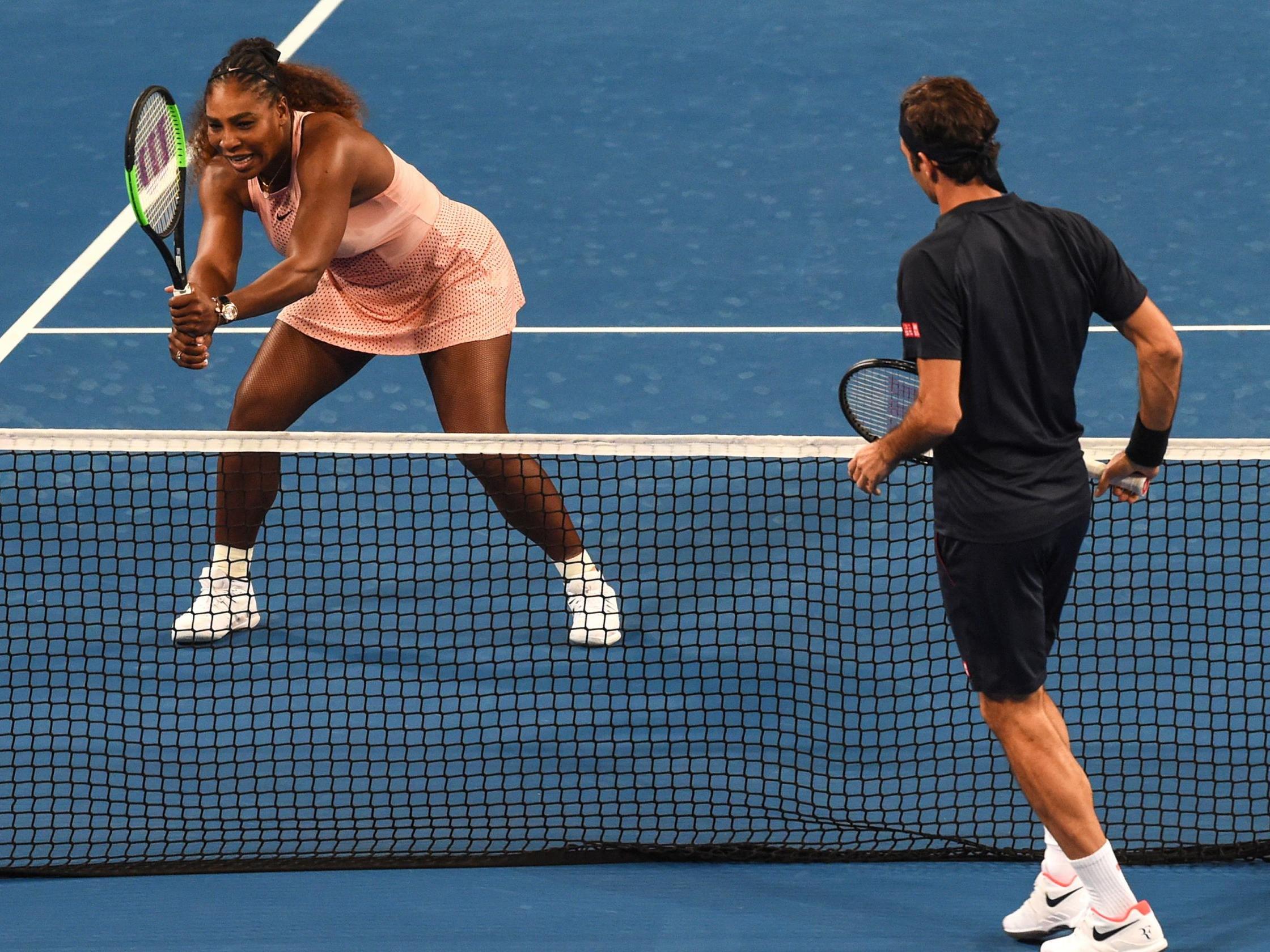 Federer and Williams clash at the net in Perth