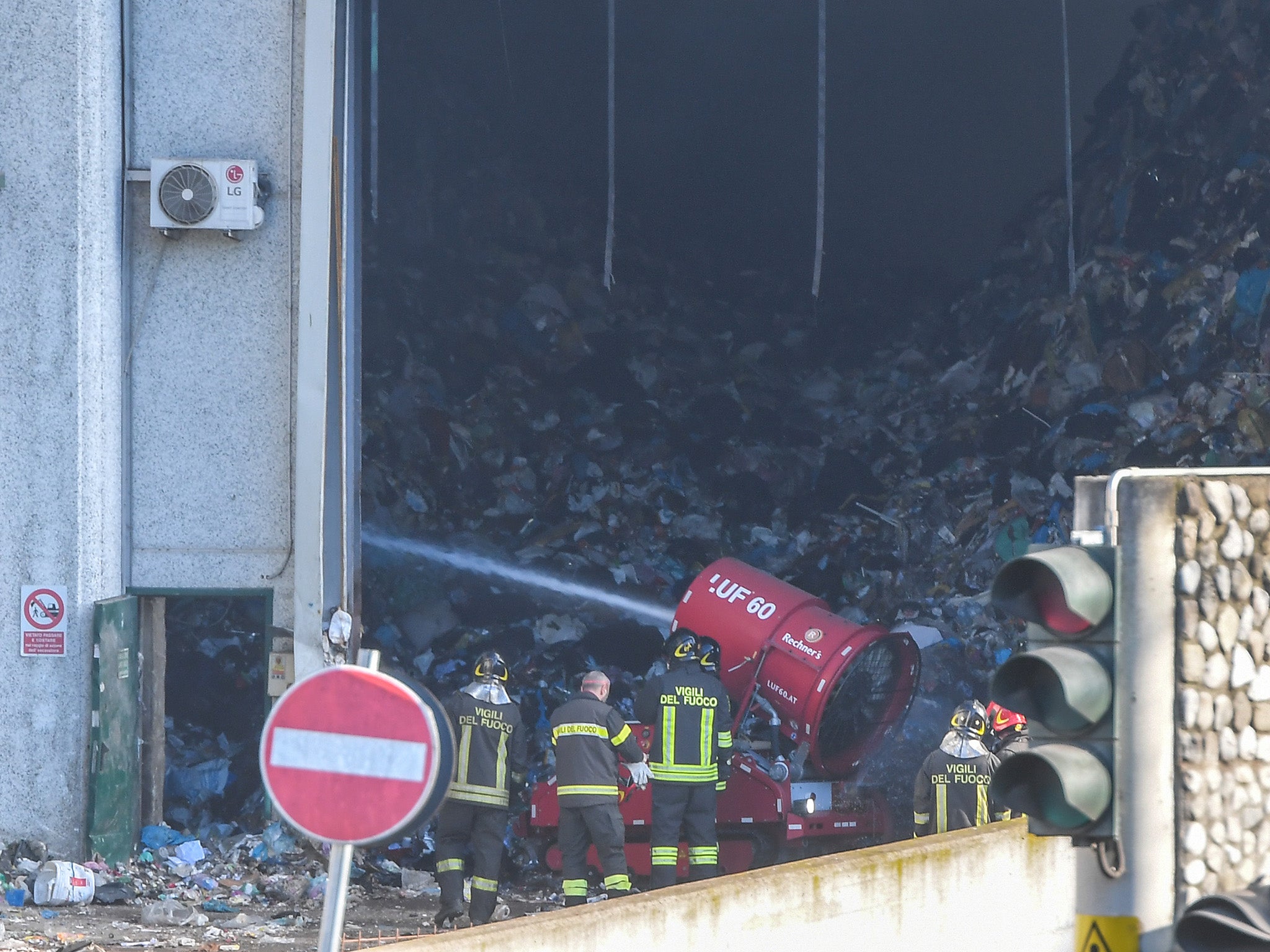 Firefighters at the TMB Salario mechanical biological waste treatment plant where a fire broke out in December