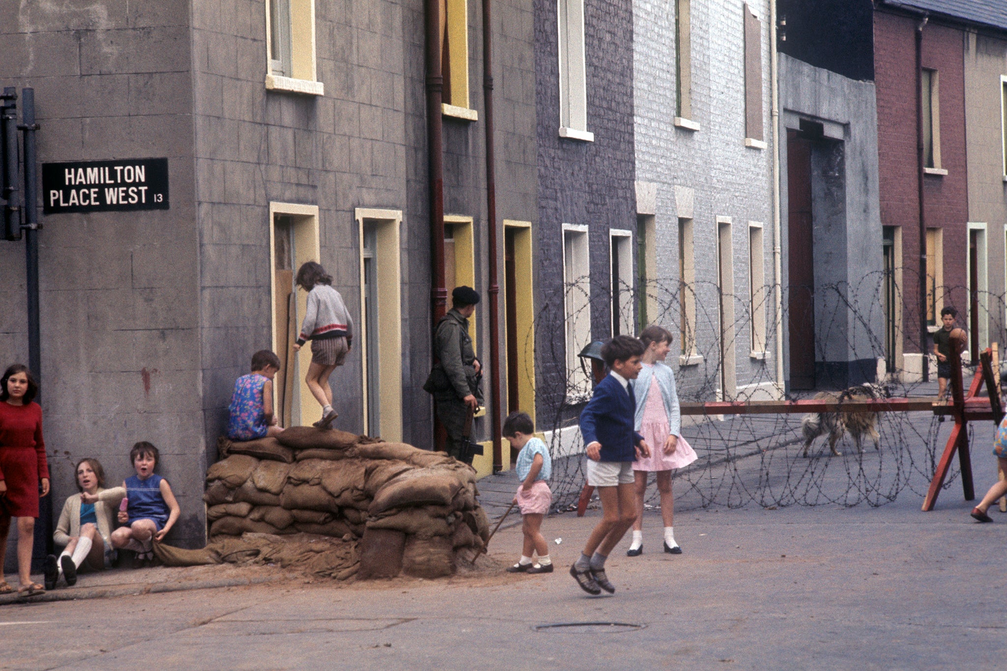 Children play amid the violence and barricades in Belfast, August 1969