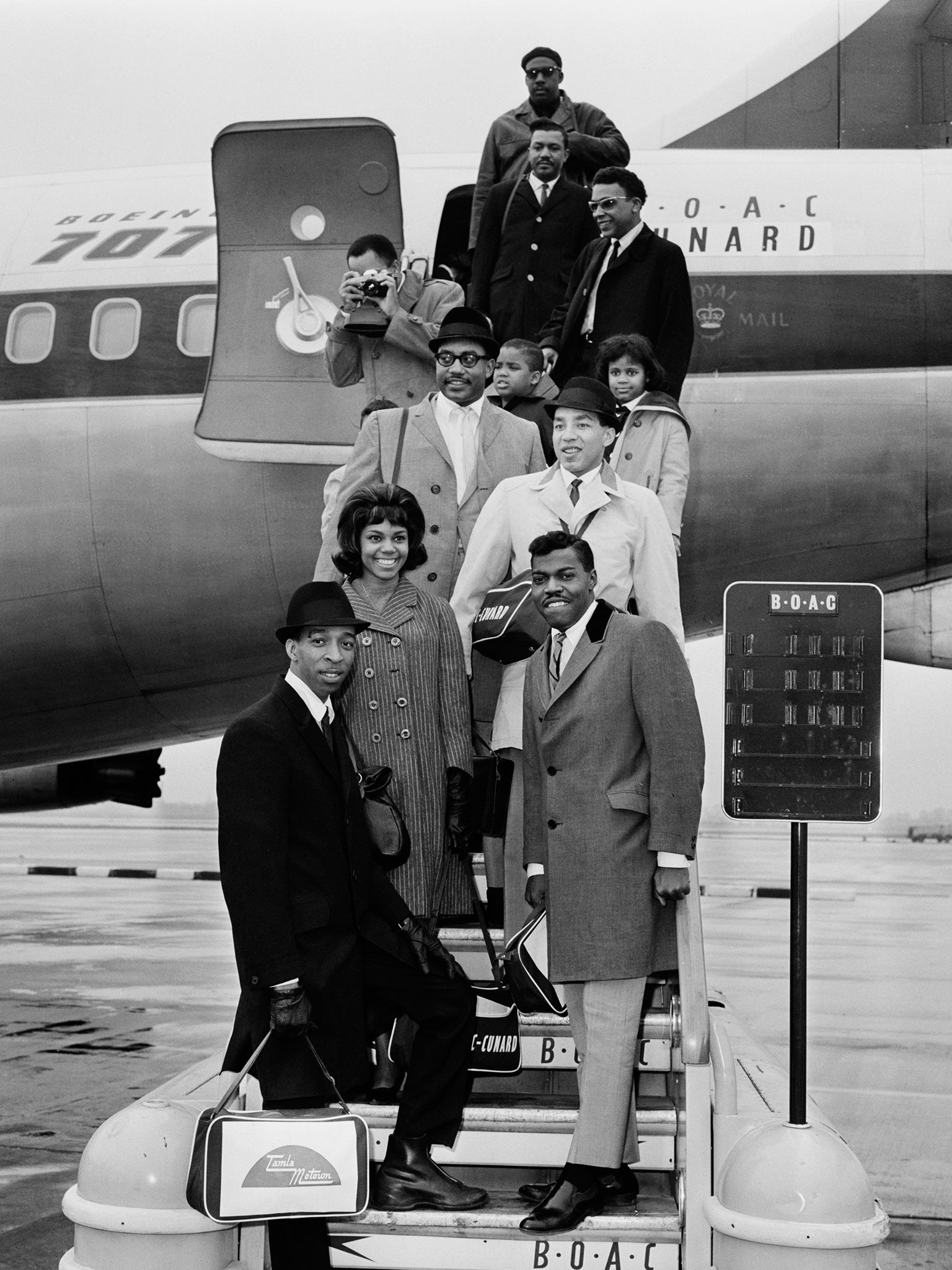 The Miracles at London (now Heathrow) airport in March 1965. Clockwise, from bottom, left: Ronnie White, Claudette Robinson, Bobby Rogers, Smokey Robinson and Pete Moore