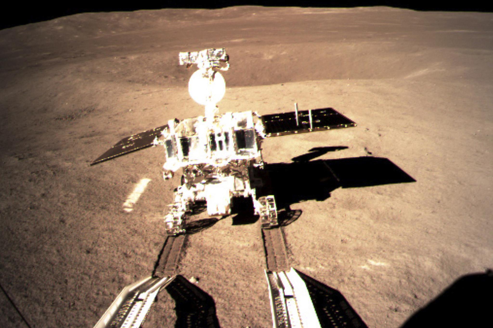 In this photo provided on Thursday, Jan. 3, 2019, by China National Space Administration via Xinhua News Agency, Yutu-2, China's lunar rover, leaves wheel marks after leaving the lander that touched down on the surface of the far side of the moon