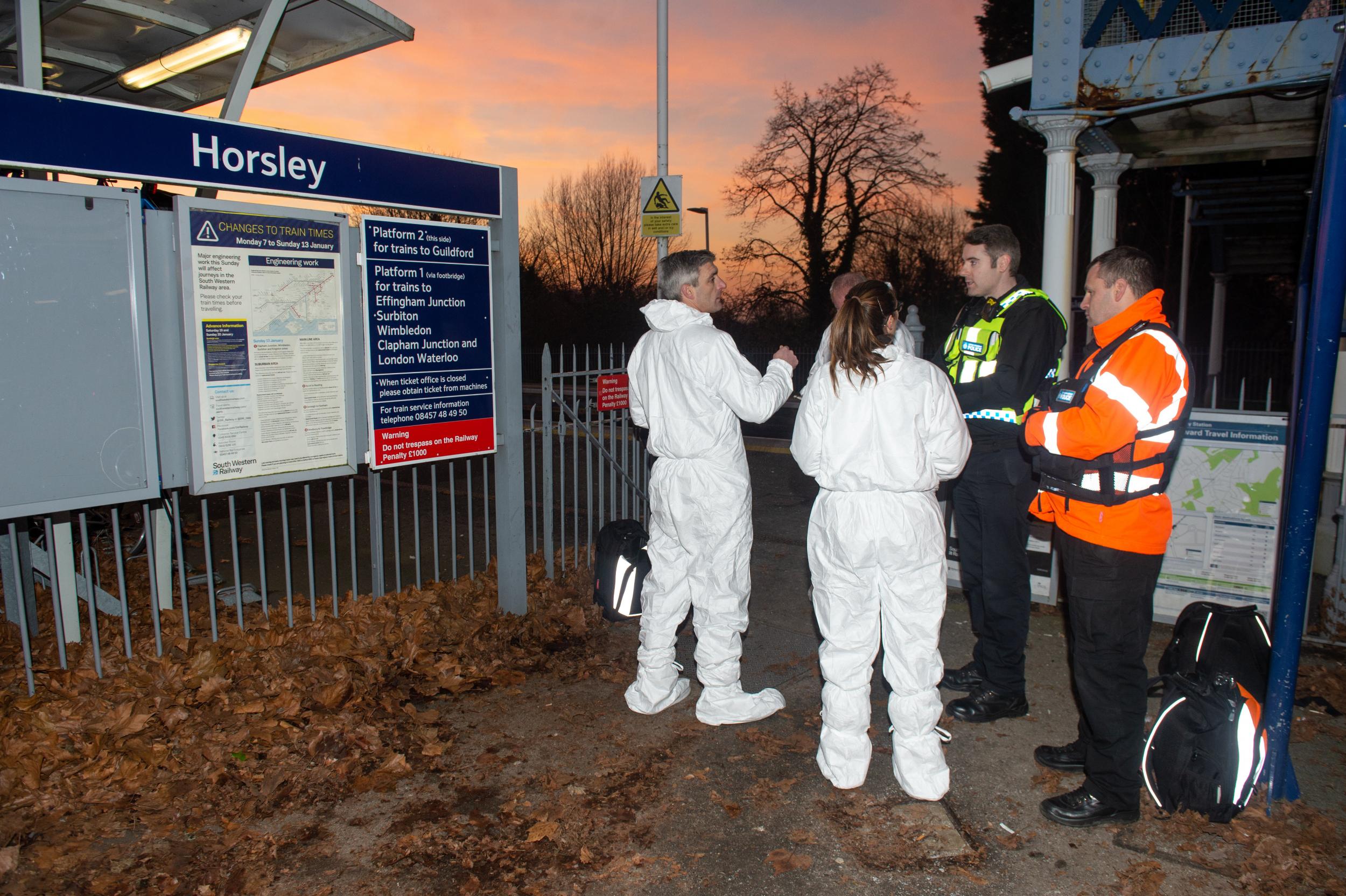 Police at Horsley station following a fatal stabbing on a train