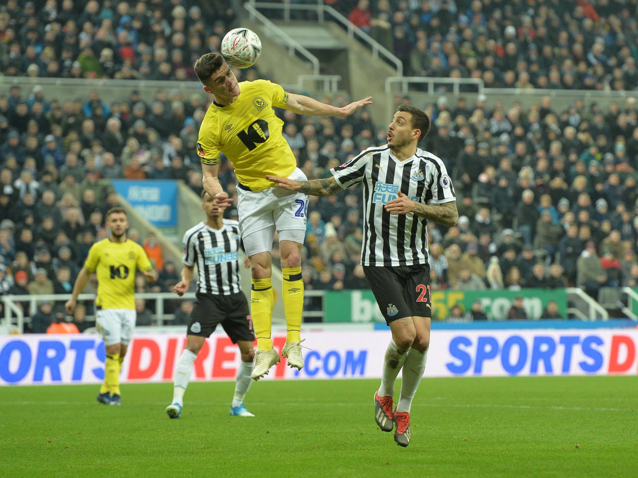 Darragh Lenihan heads clear under pressure from Joselu