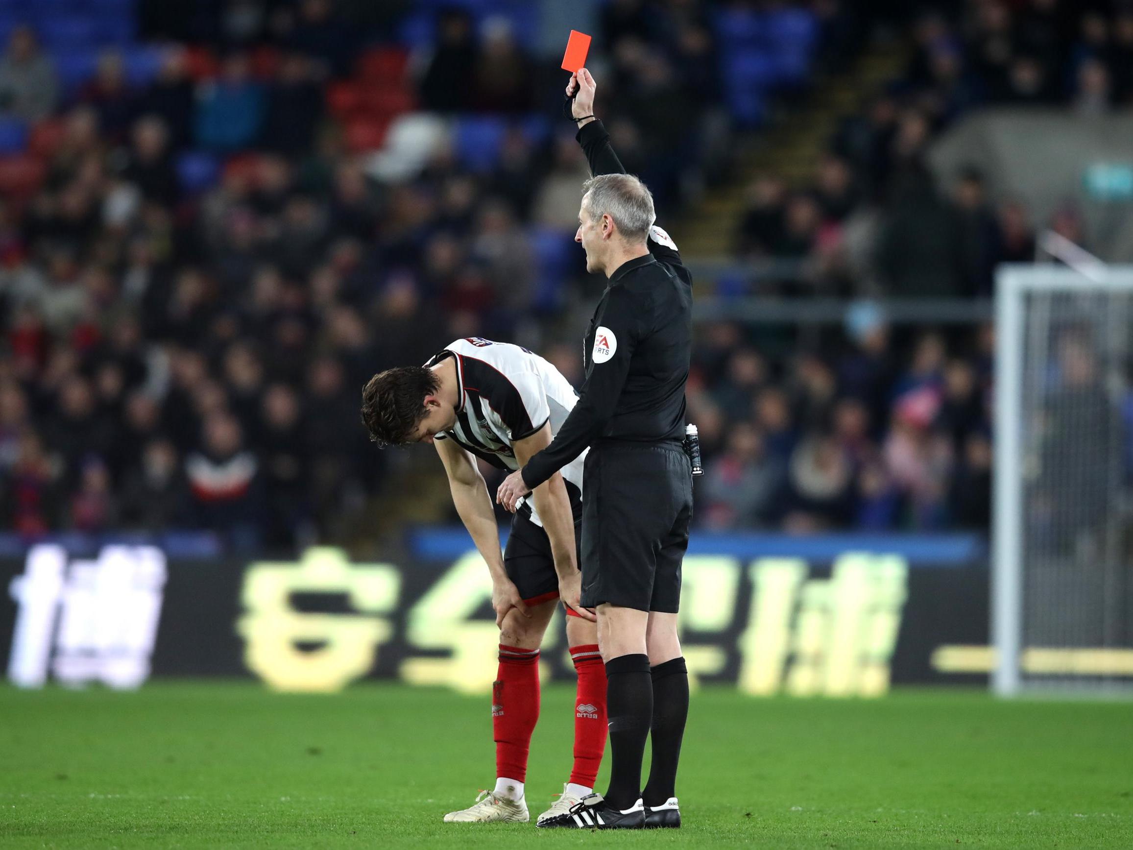 Andrew Fox is shown red by referee Mark Atkinson