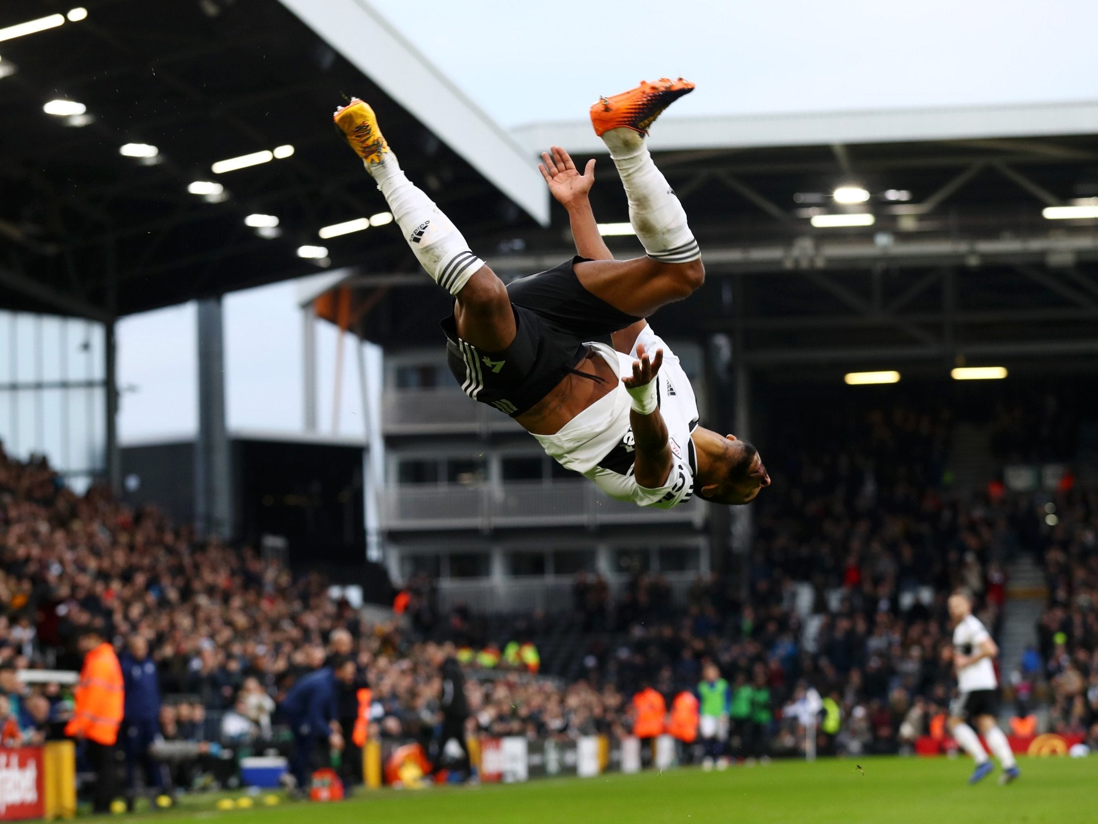 Denis Odoi celebrates in emphatic style after scoring Fulham's opener