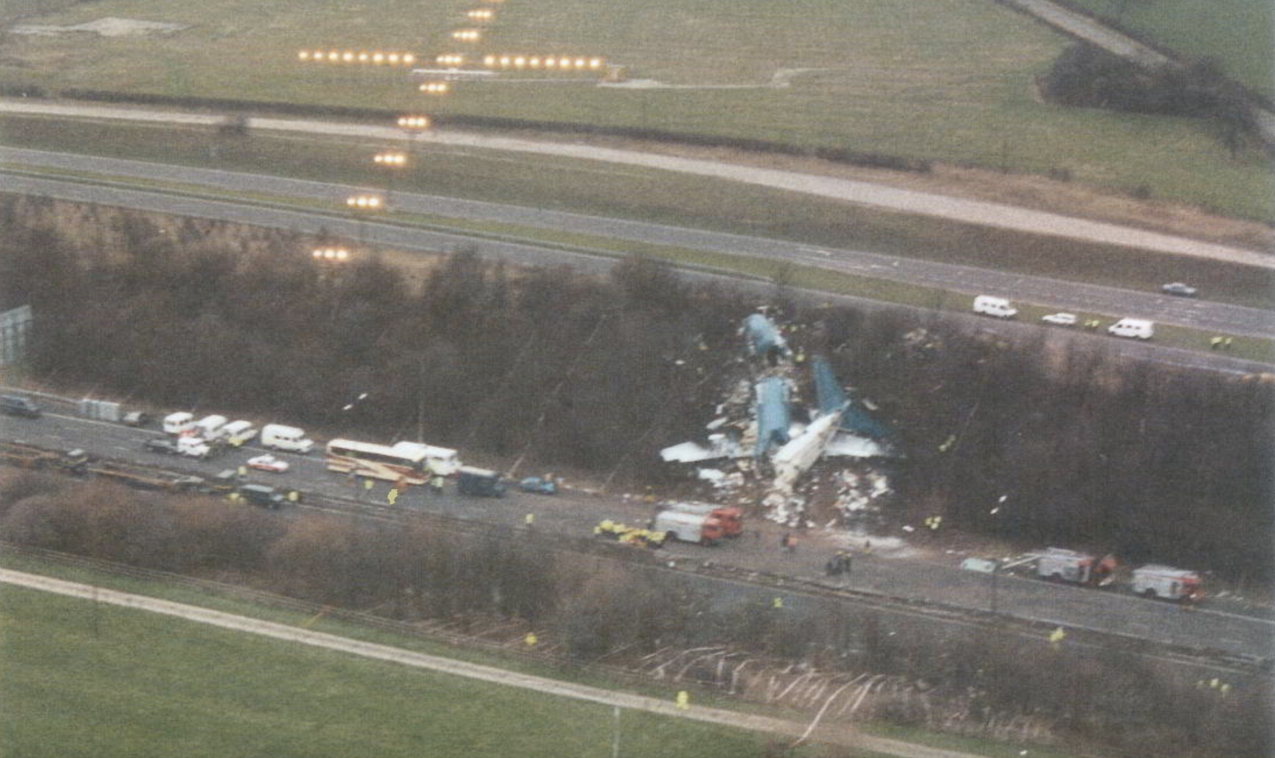 Crash site: the Boeing 737 came down beside the M1, just short of the runway at East Midlands Airport