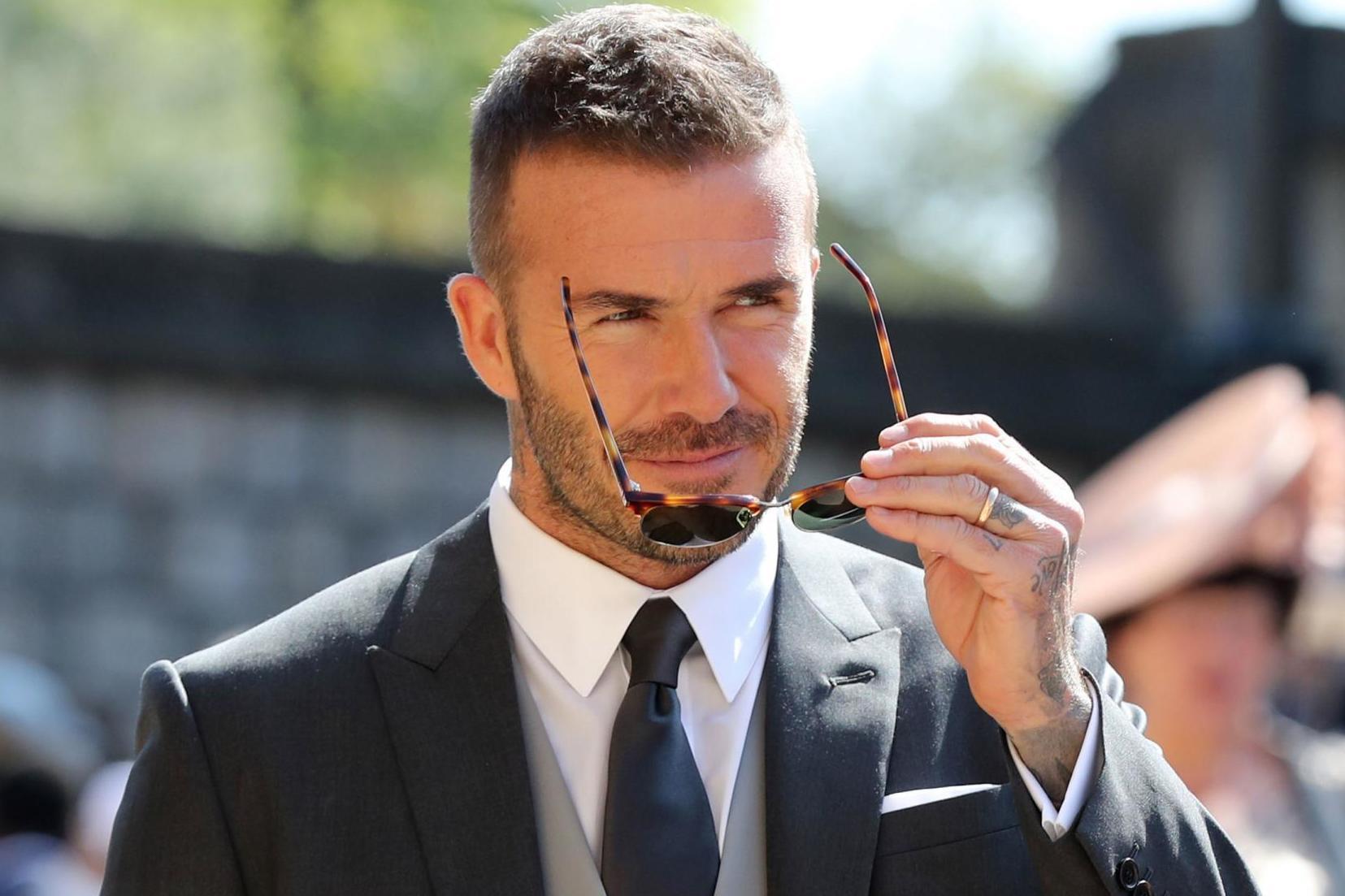 David Beckham wore teal eyeshadow as magazine cover star (Getty)