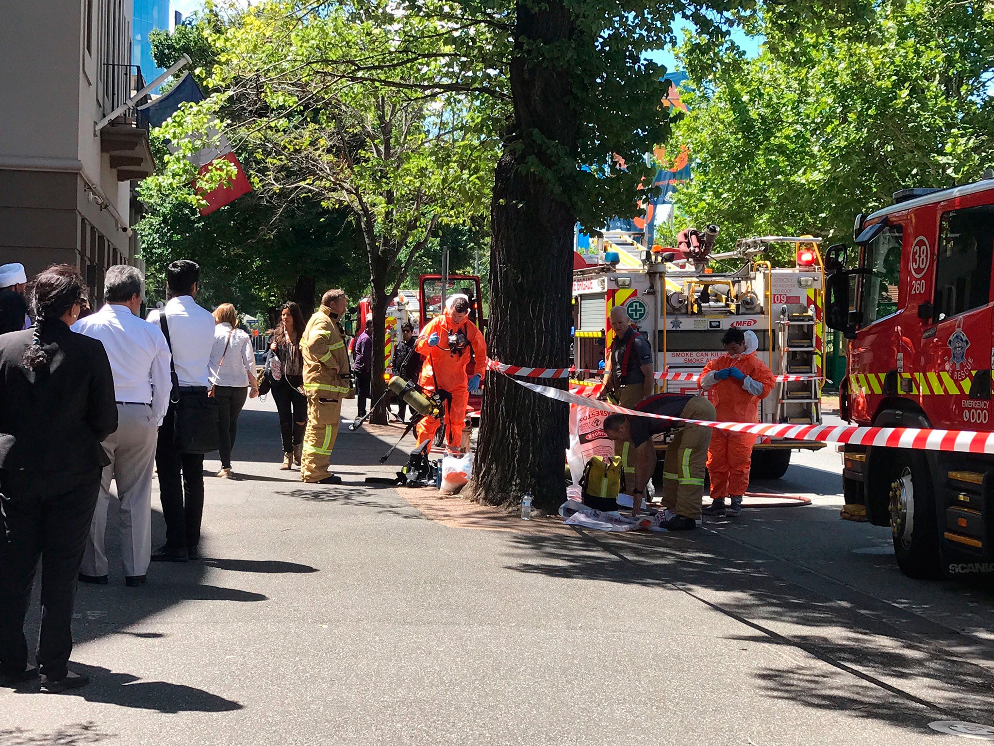 Emergency services outside the building housing the consulates of India and France in Melbourne on Tuesday