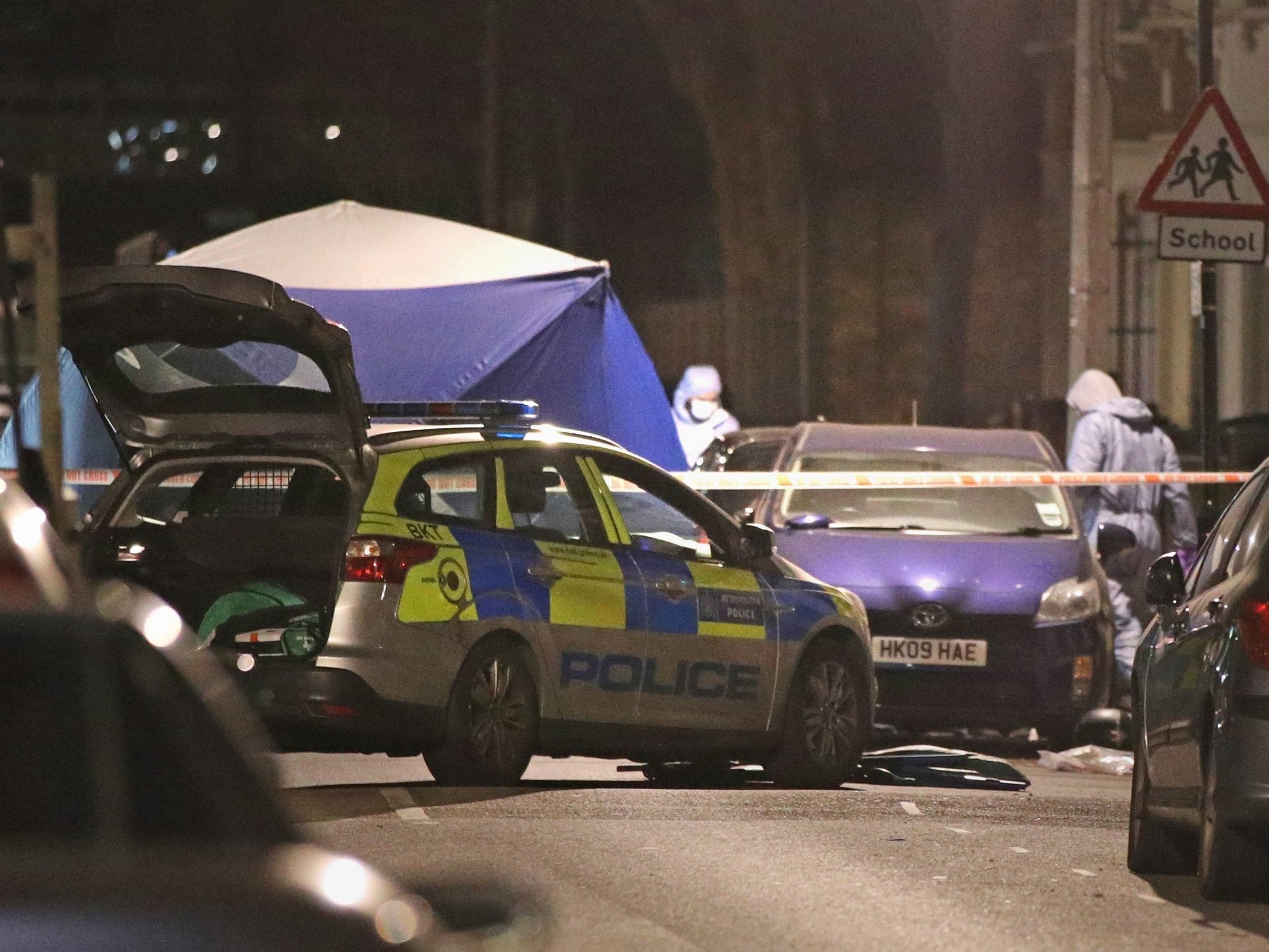 Forensic investigators at the scene in Leyton, Waltham Forest in north-east London where a 14-year-old boy died after he was found with stab injuries