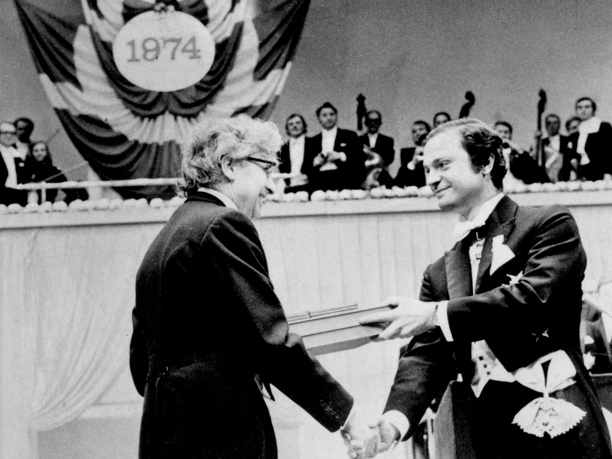 Antony Hewish (left) receives the Nobel prize in 1974, with Bell excluded from the list of recipients (PA)