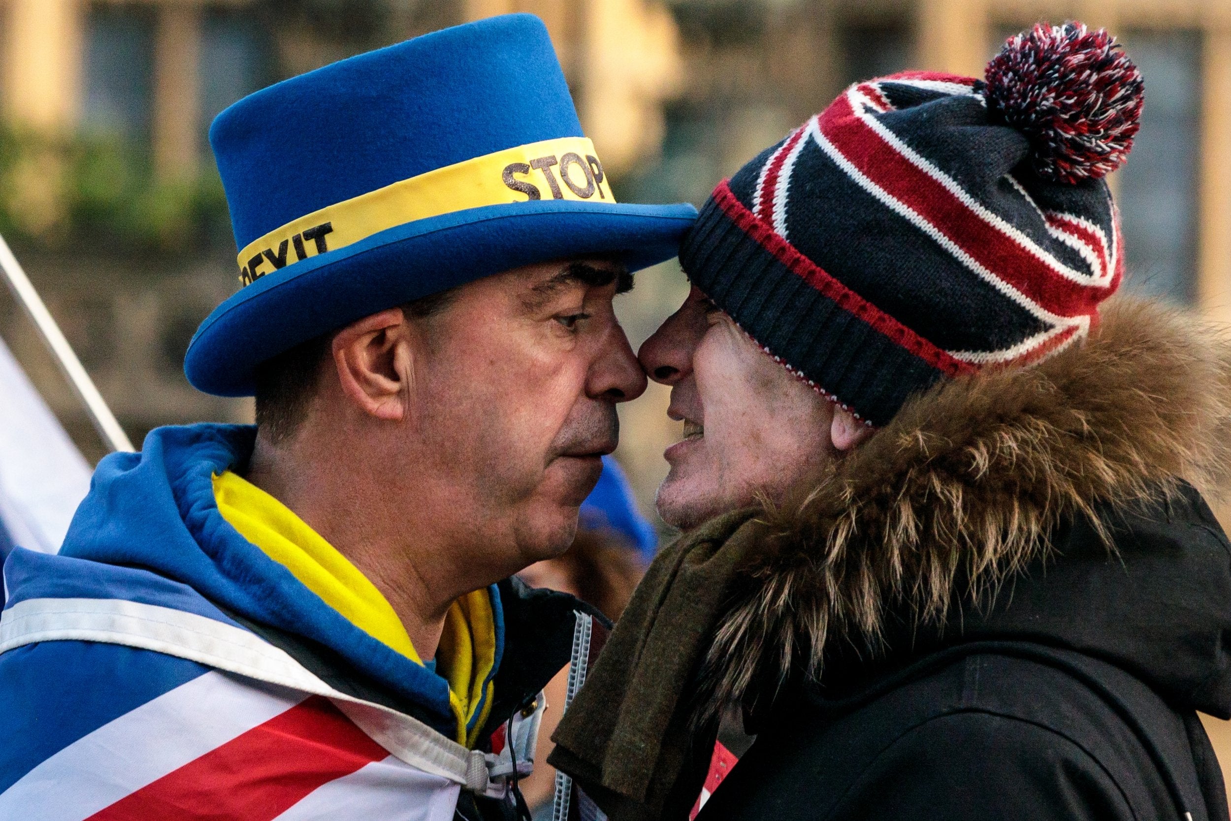 Anti-Brexit protester Steve Bray (left) and a pro-Brexit protester argue as they demonstrate outside the Houses of Parliament in Westminster on Tuesday