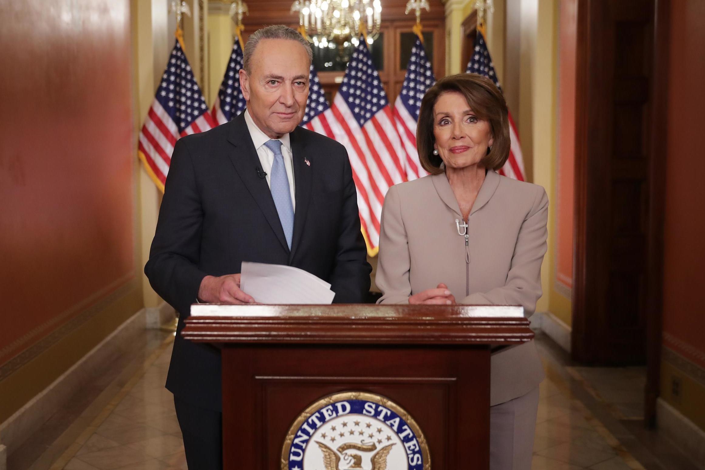 Senate minority leader Chuck Schumer and speaker of the House Nancy Pelosi deliver a televised response to President Donald Trump's national address about border security at the US Capitol on 8 January (Chip Somodevilla/Getty)