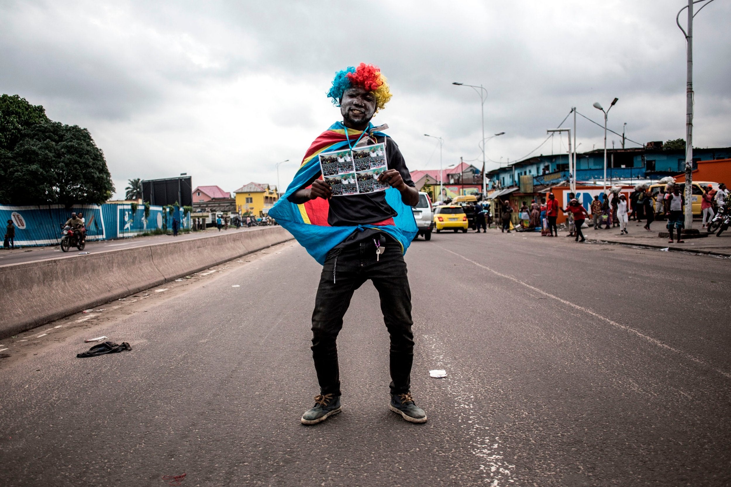 A supporter of Felix Tshisekedi, newly elected Congolese president, celebrates in the streets of Kinshasa (AFP/Getty)