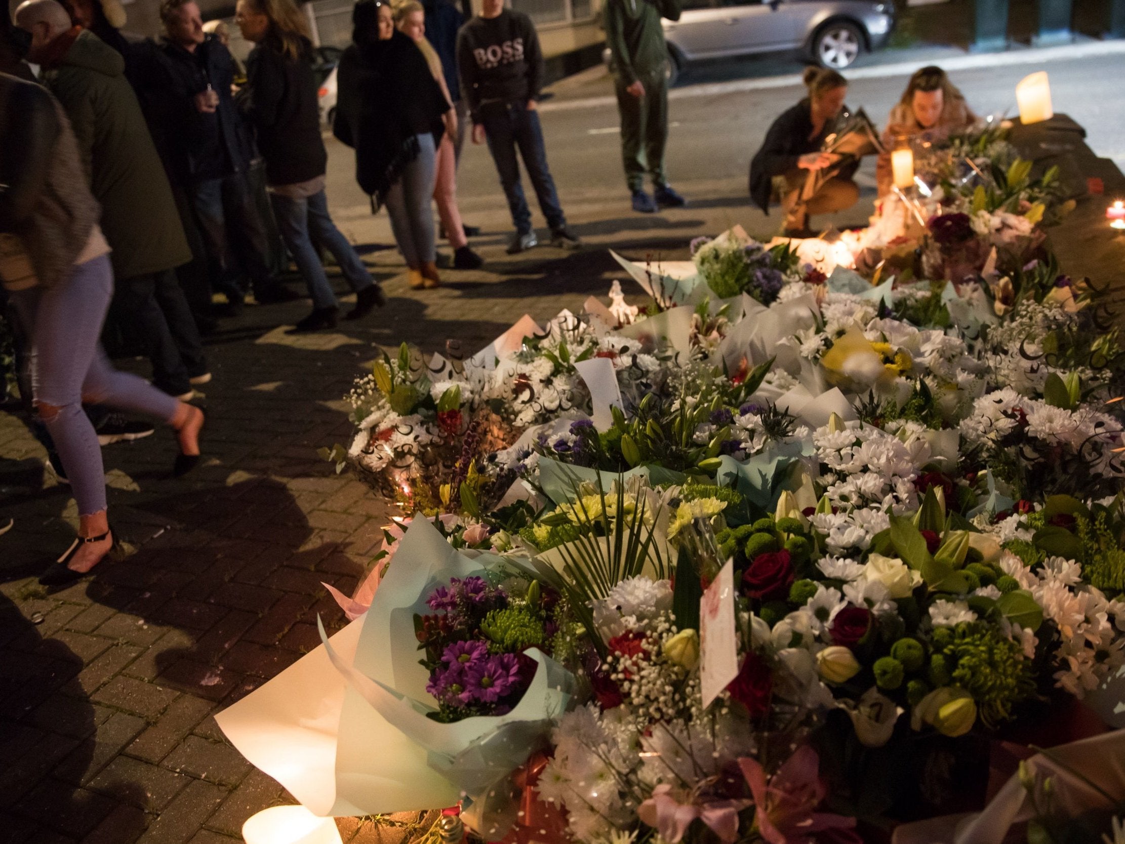 Floral tributes are left at a house on Burnaby Road in Coventry during a vigil, after police fatally shot a man during an "intelligence-led" operation on Friday (PAAaron Chown/PA )