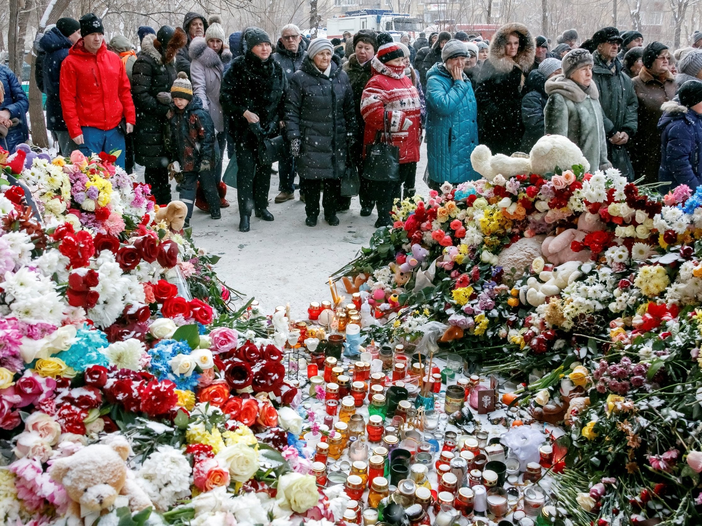 People gather to commemorate victims of the explosion (Reuters)