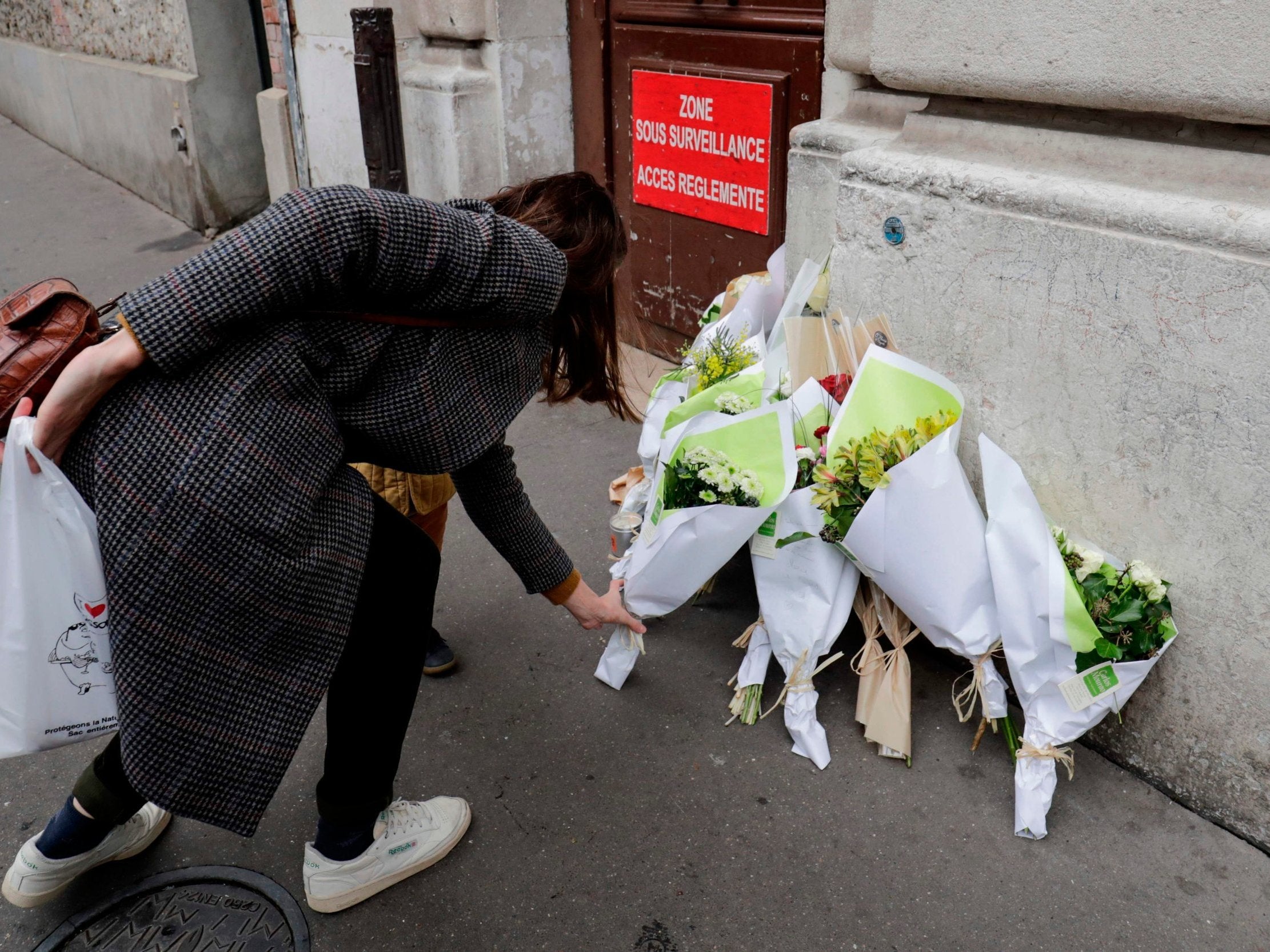 Flowers laid outside Paris fire station in the 9th arrondissement (AFP/Getty)