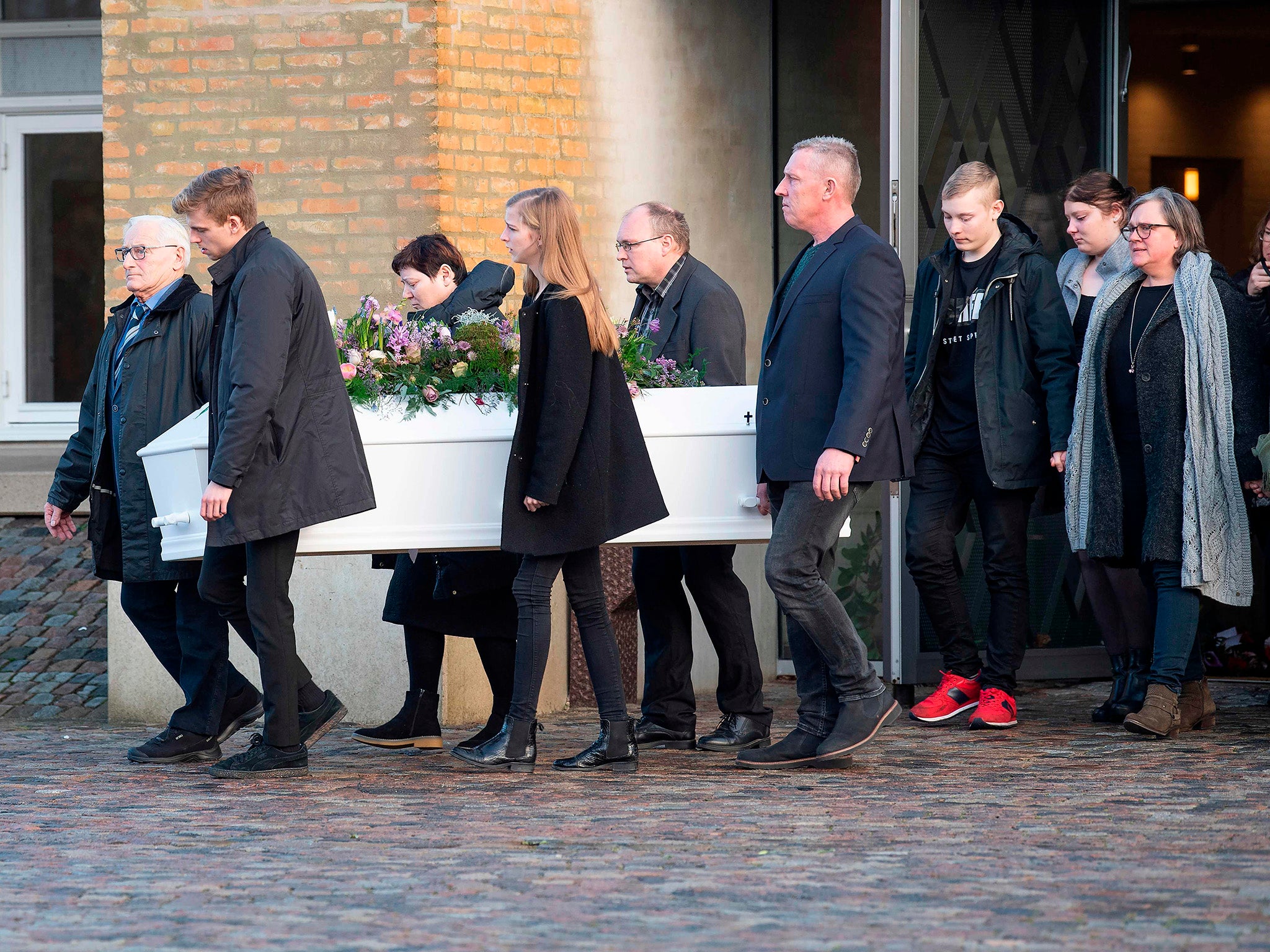 Family and friends follow the coffin during the funeral of Danish student Louisa Vesterager Jespersen at Fonnesbaek Church in Ikast, Denmark