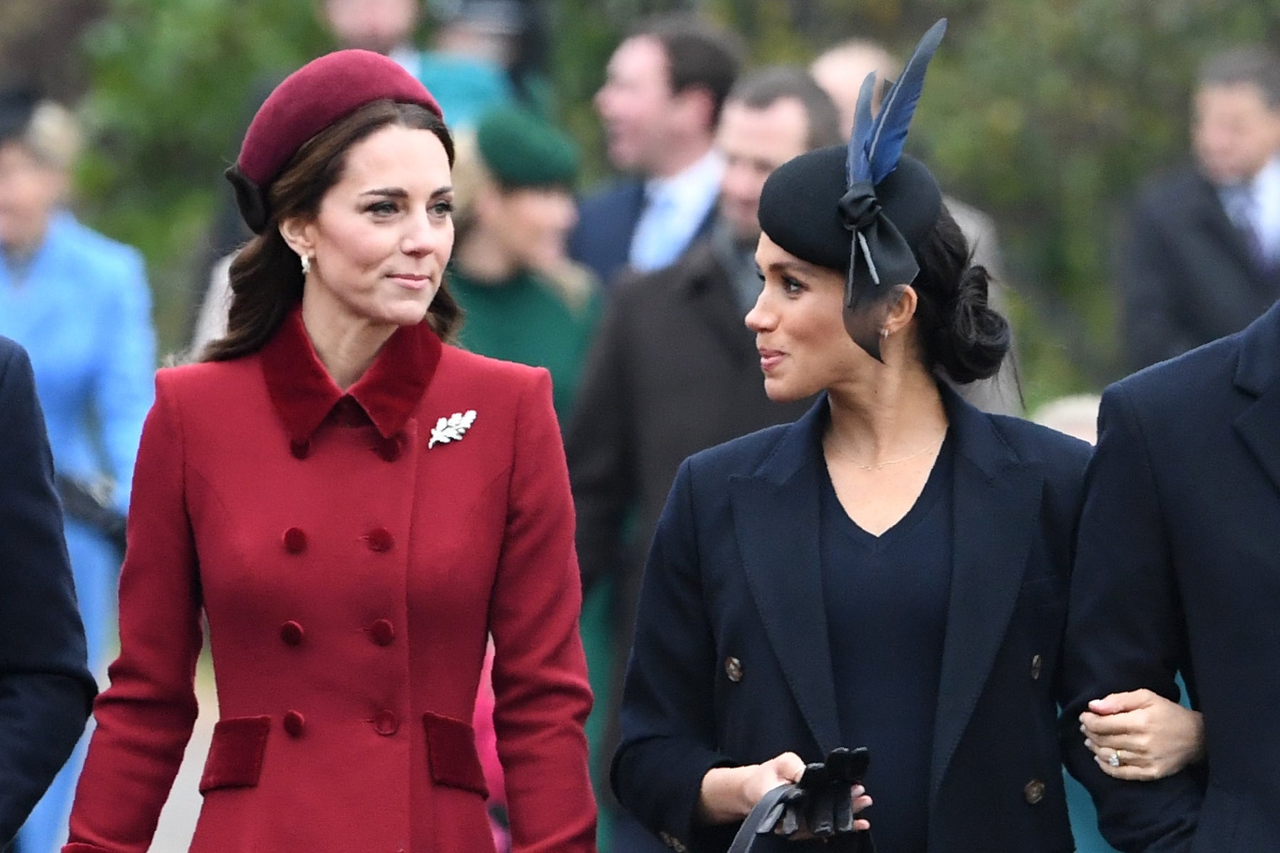 Smiles for the camera: Kate and Meghan arriving for the traditional Christmas Day service in Sandringham, Norfolk