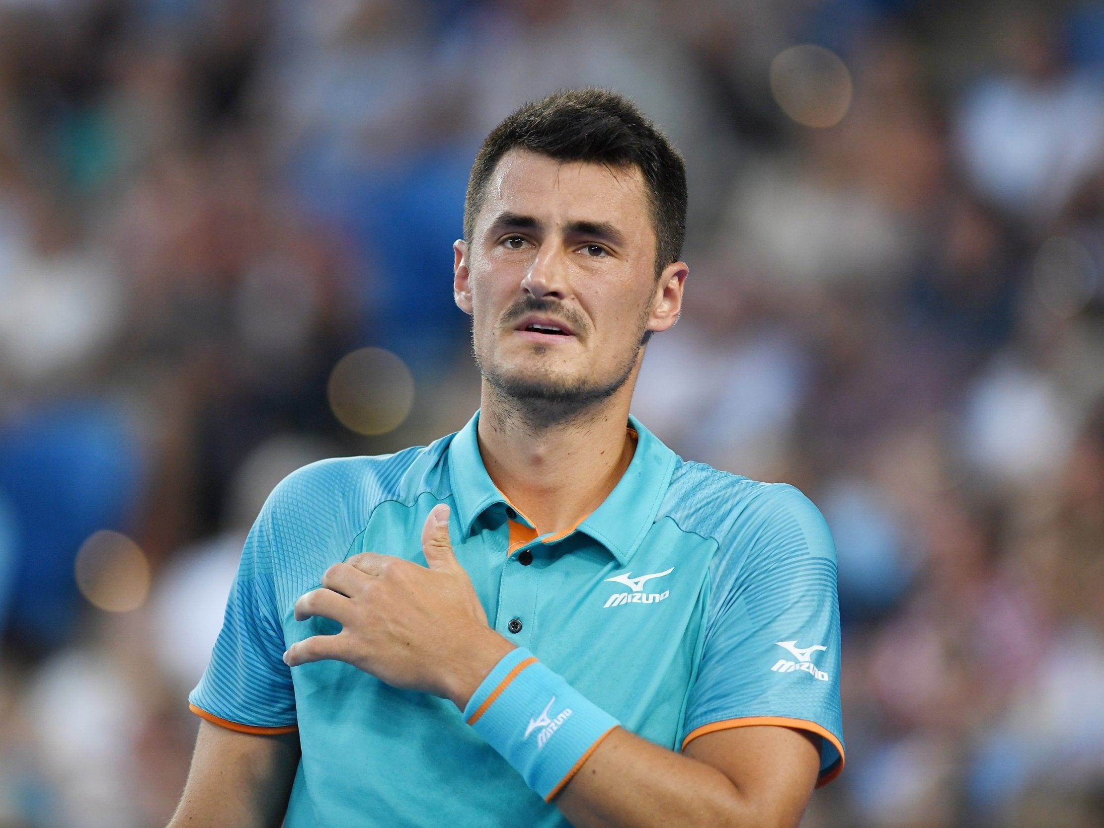 Bernard Tomic has denied allegations of making threats against Lleyton Hewitt's family