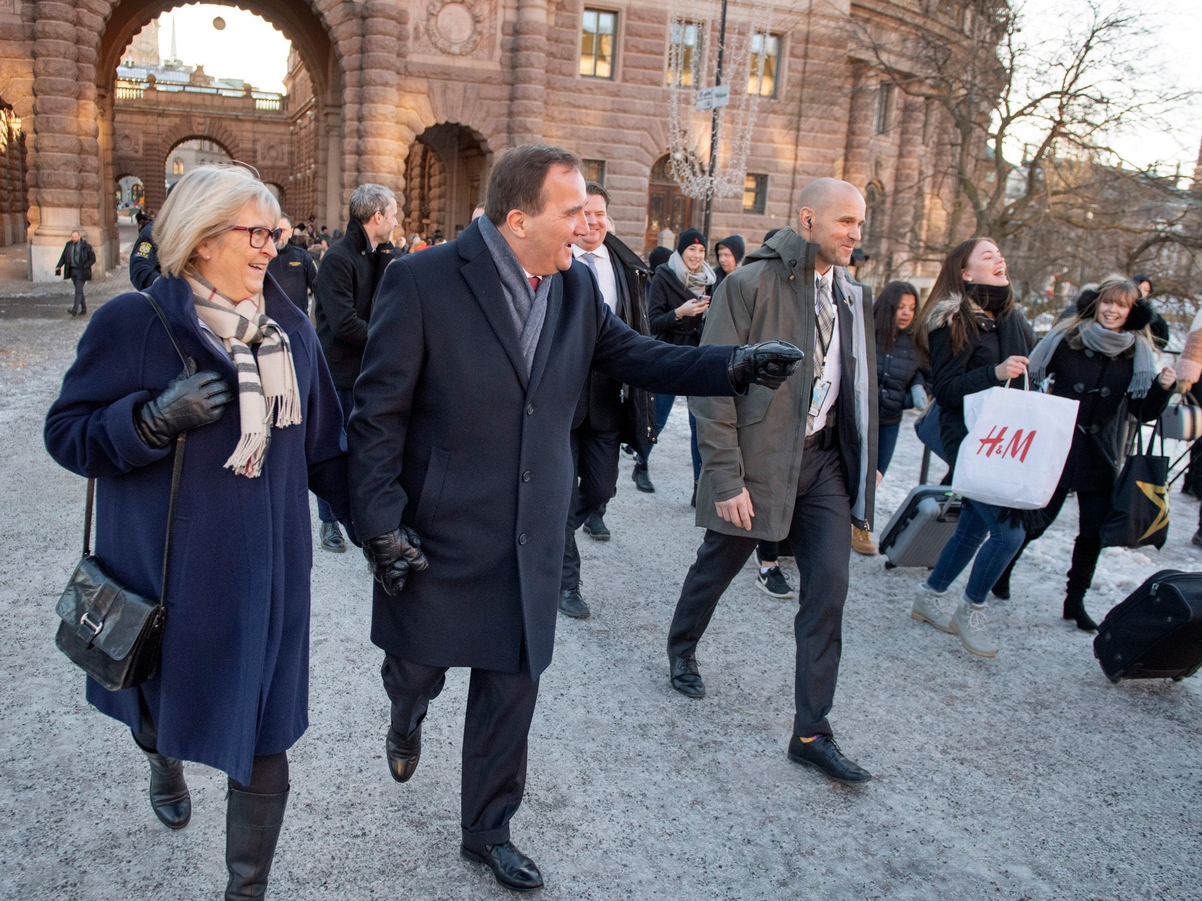 Sweden's Prime Minister Stefan Lofven (C) leaves the Swedish Parliament Riksdagen together with his wife Ulla (L) after after being voted back in as prime minister