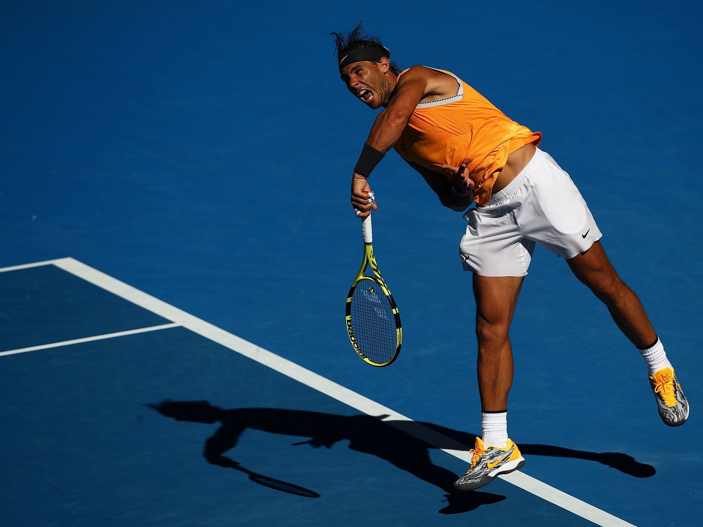 Rafael Nadal serves vs Tomas Berdych