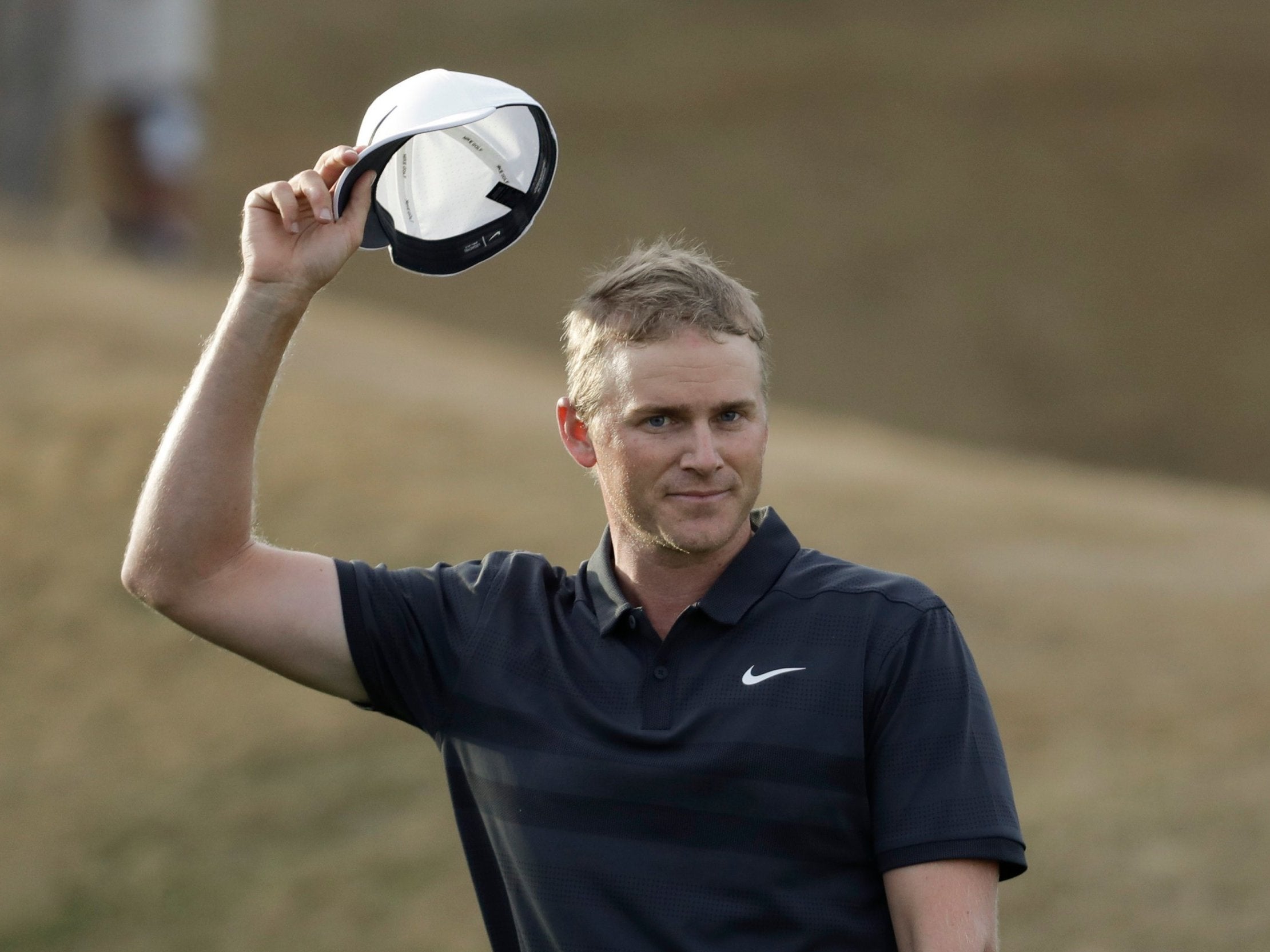 Adam Long celebrates on the 18th green after winning the Desert Classic