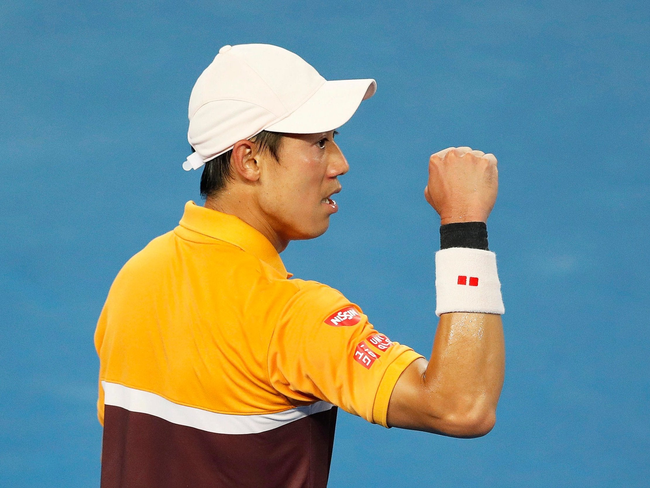 Kei Nishikori celebrates his win over Pablo Carreno Busta