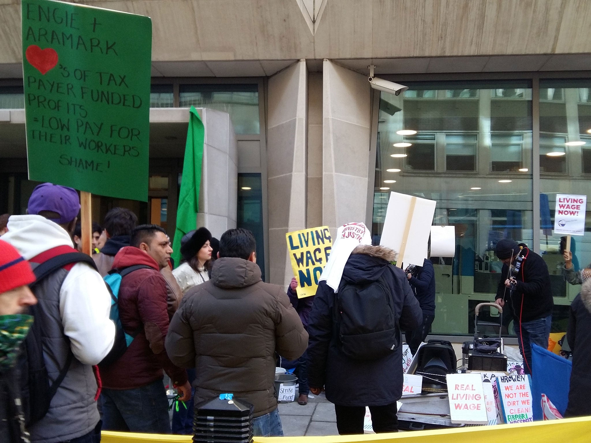 Members of the United Voices of the World union on strike outside the Ministry of Justice headquarters in London on 22 January