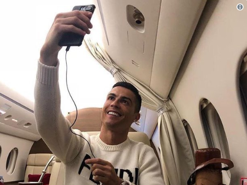 Cristiano Ronaldo takes a selfie aboard a private jet