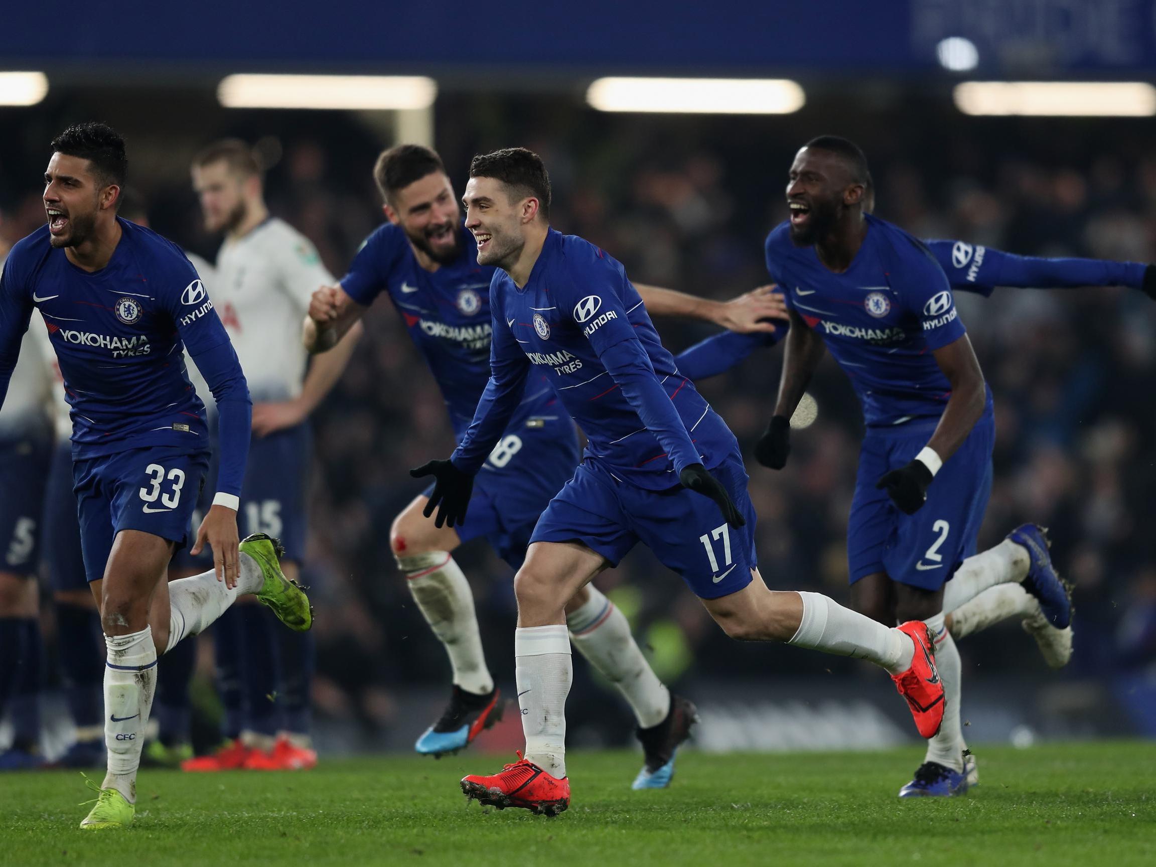 Chelsea’s players celebrate after David Luiz scored the winning penalty