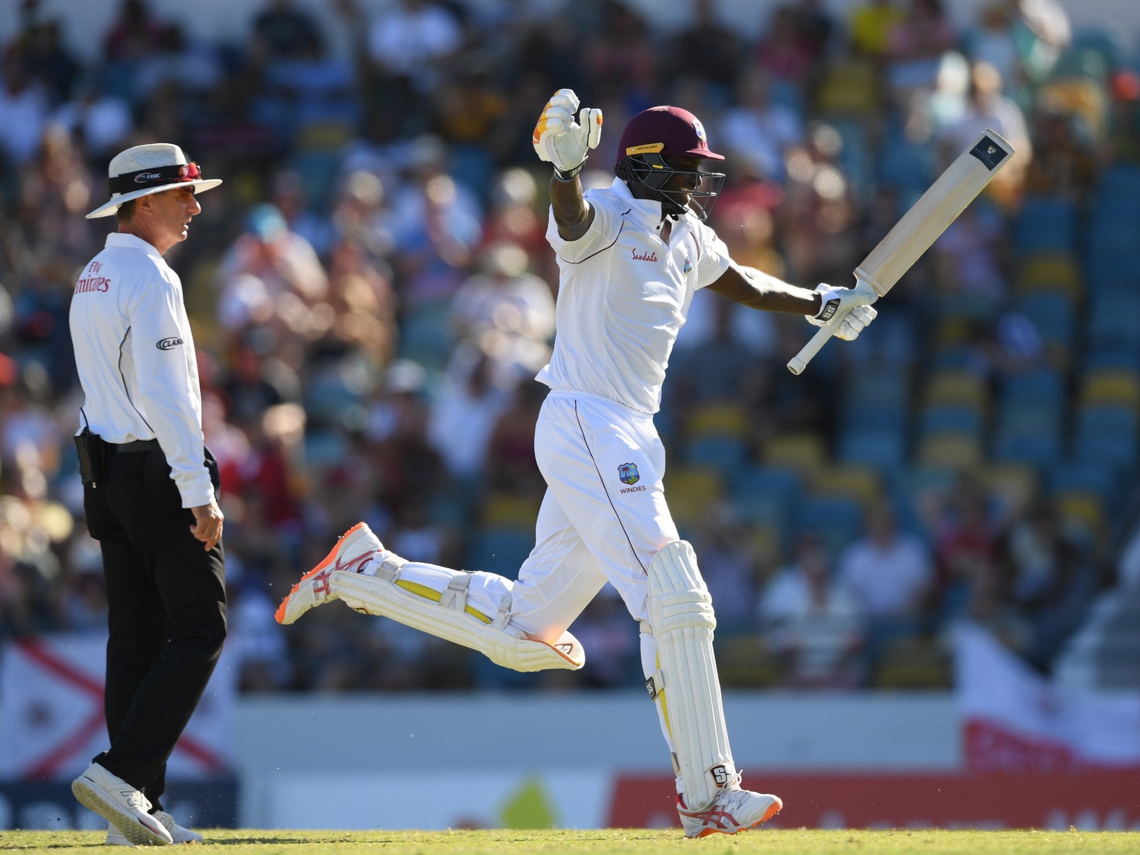 Jason Holder celebrates reaching his double-century