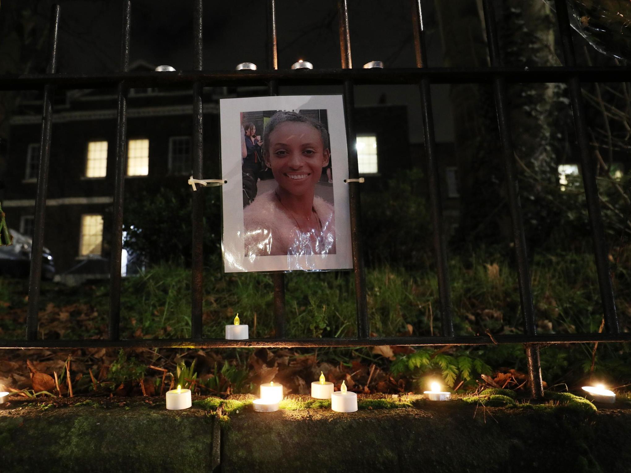 Floral tributes are left to a woman in Walthamstow