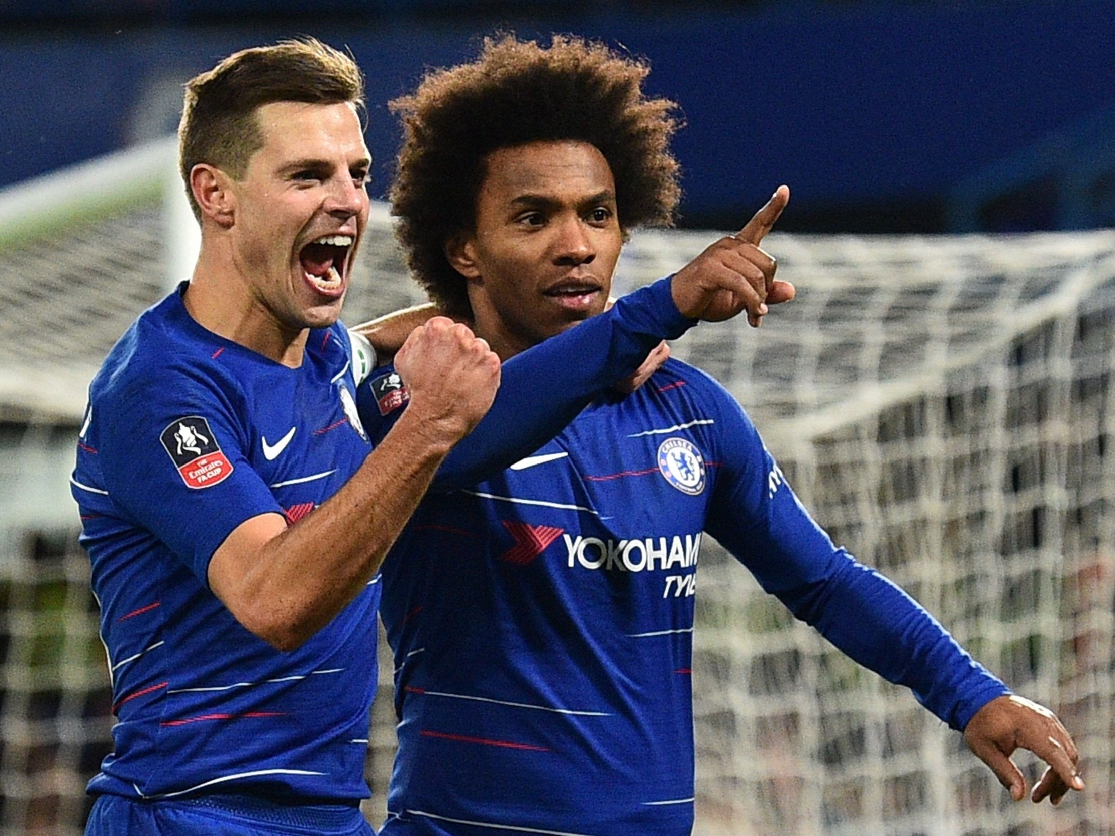 Cesar Azpilicueta and Willian celebrate the Brazilian scoring