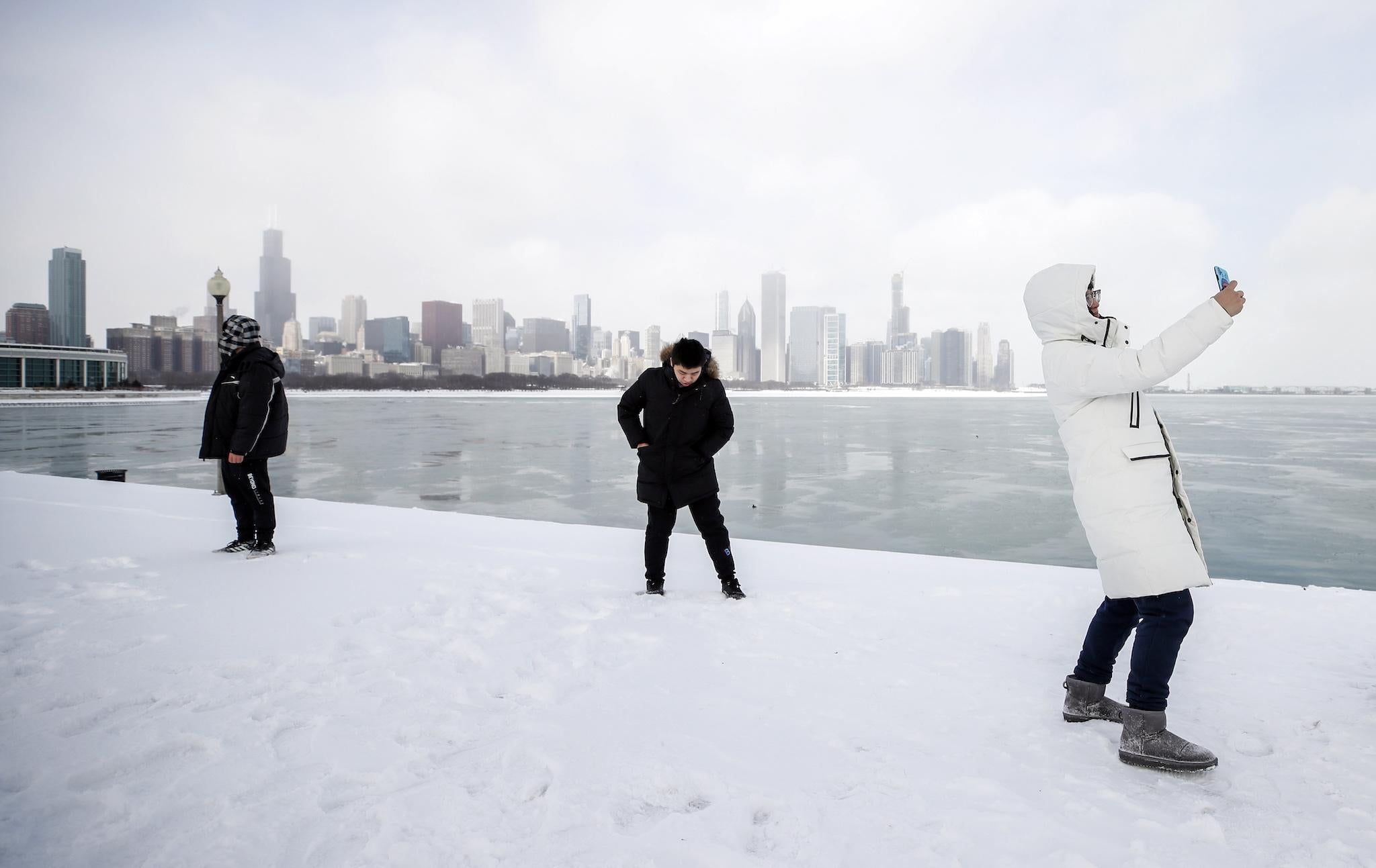 A High School student from China takes a selfie along Lake Michigan in Chicago, Illinois, USA, 29 January 2019