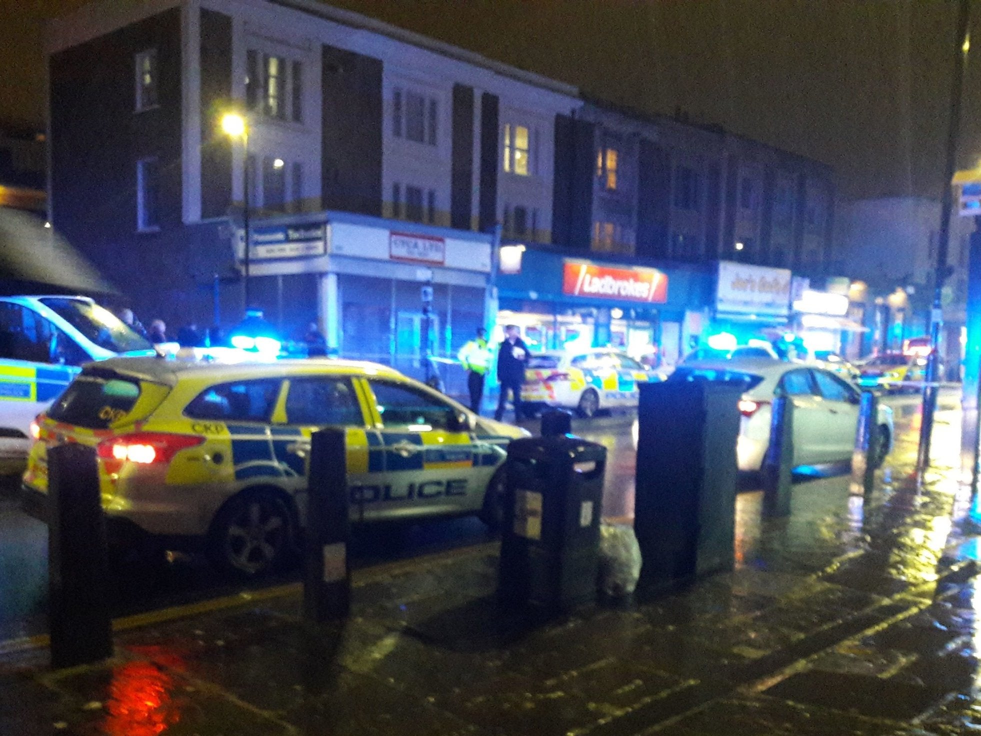 Police at the scene of the fatal stabbing in Caledonian Road, Islington