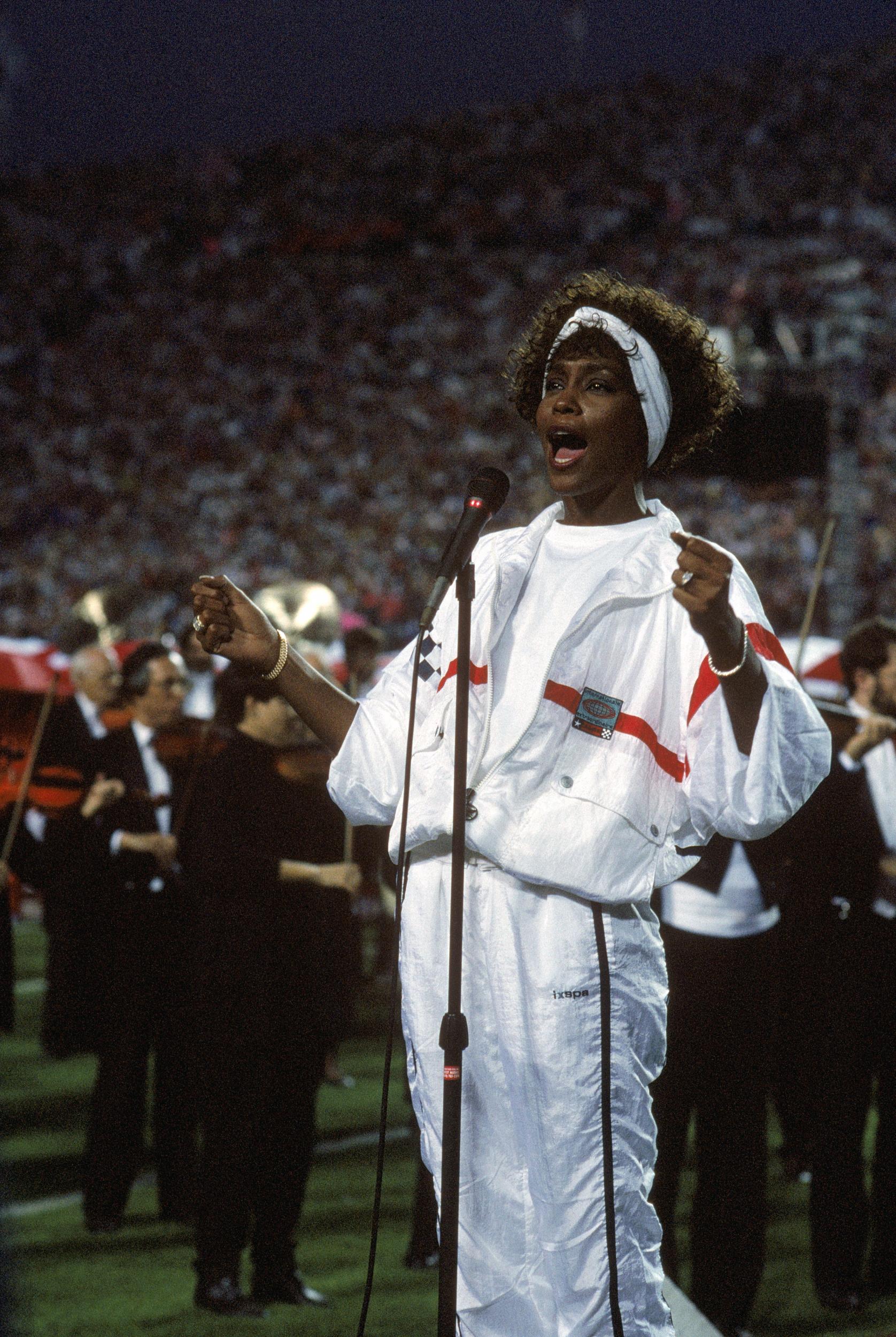 1991 - Whitney Houston
<br><br>
For her rendition of the Star Spangled Banner at the Super Bowl Whitney Houston wore a white tracksuit with red Nike trainers and her hair held back by a headband