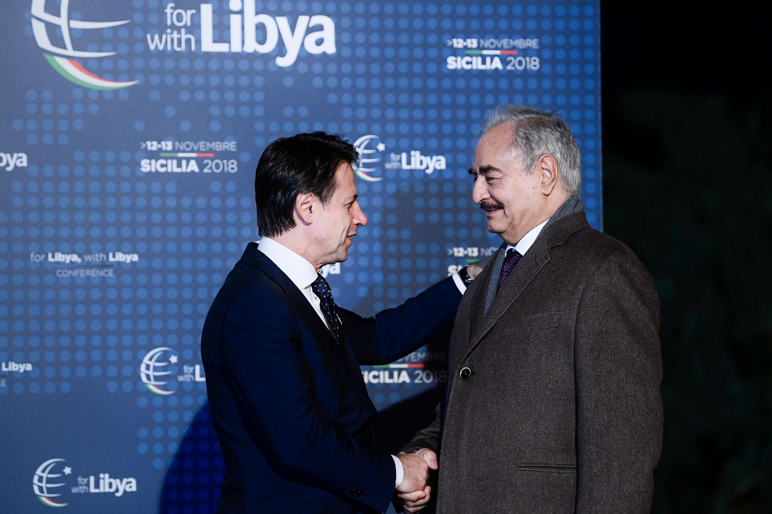 Italian PM Giuseppe Conte greets Khalifa Haftar upon his arrival for a conference on Libya in Palermo last year (AFP/Getty)