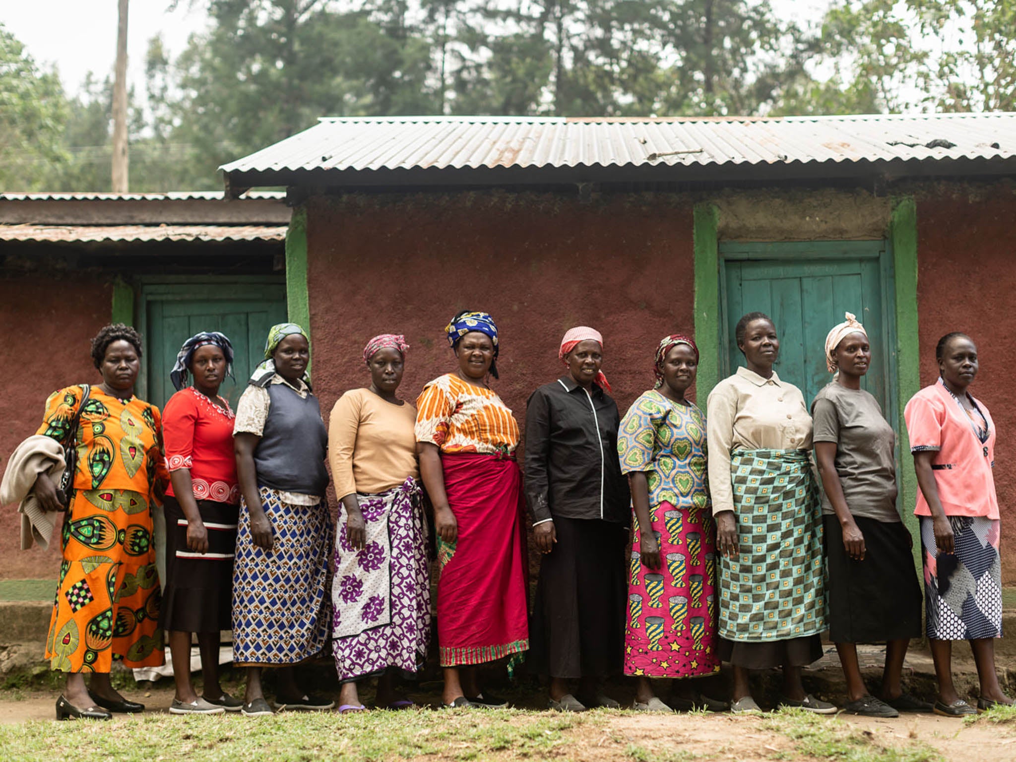 Kibukwo coffee cooperative: Women, like Esther Chepkwony pictured here in black in the middle, are now proudly earning their own income. Feeding and educating their children as well as providing sanitary care for their daughters – a taboo subject – are their top priorities